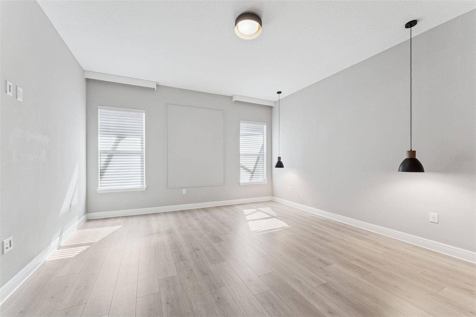 19058 PLANETREE STREET, Orlando, FL 32827 Bright primary bedroom with ample space and natural light.