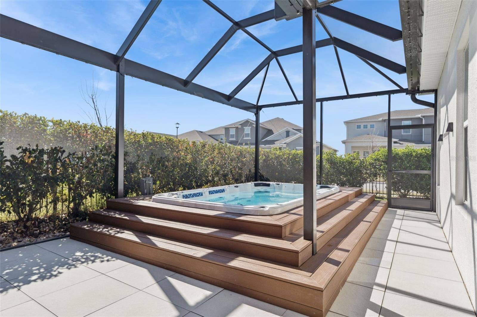19058 PLANETREE STREET, Orlando, FL 32827 Spacious screened patio overlooking the private backyard area.