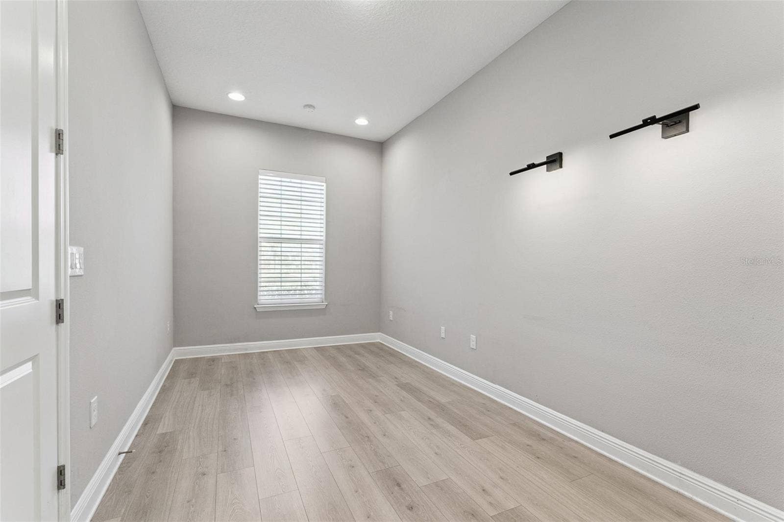 19058 PLANETREE STREET, Orlando, FL 32827 Versatile office/den with natural light and ample space.