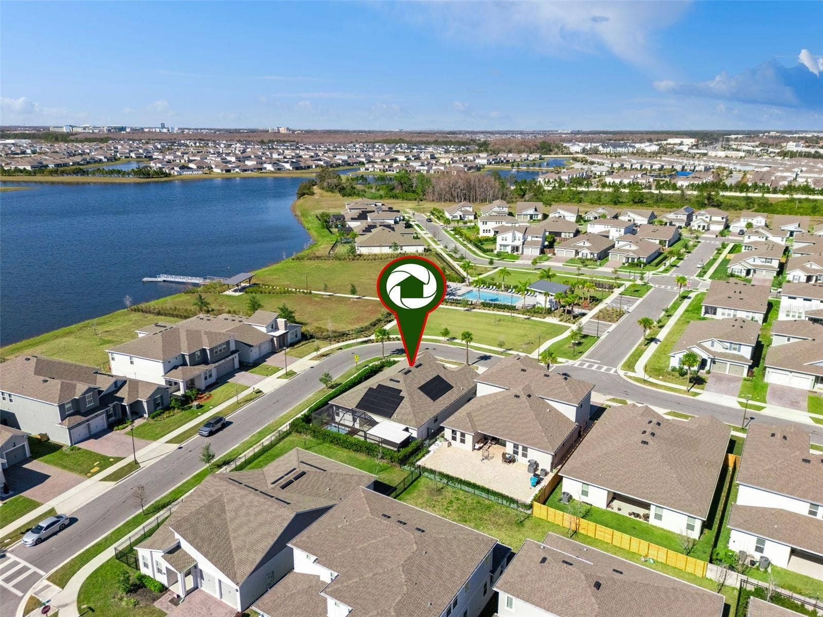 19058 PLANETREE STREET, Orlando, FL 32827 Aerial view showing the communitys scenic surroundings and nearby water views.