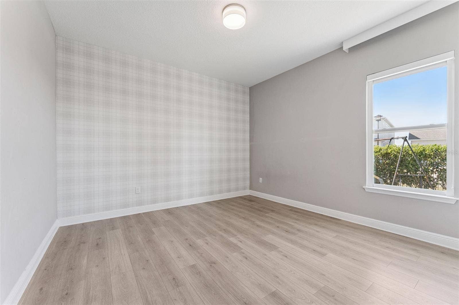 19058 PLANETREE STREET, Orlando, FL 32827 Spacious third bedroom with a bright, open feel.