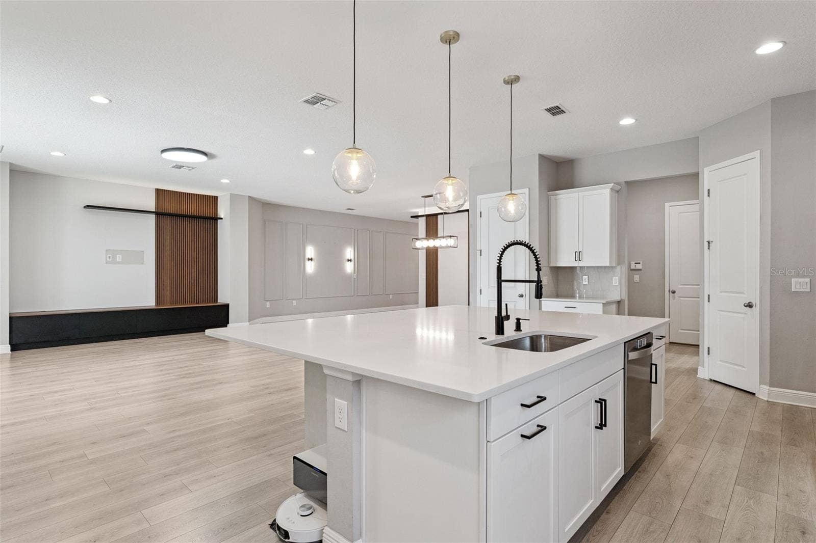 19058 PLANETREE STREET, Orlando, FL 32827 Modern kitchen with abundant cabinetry, counter space, and natural light.