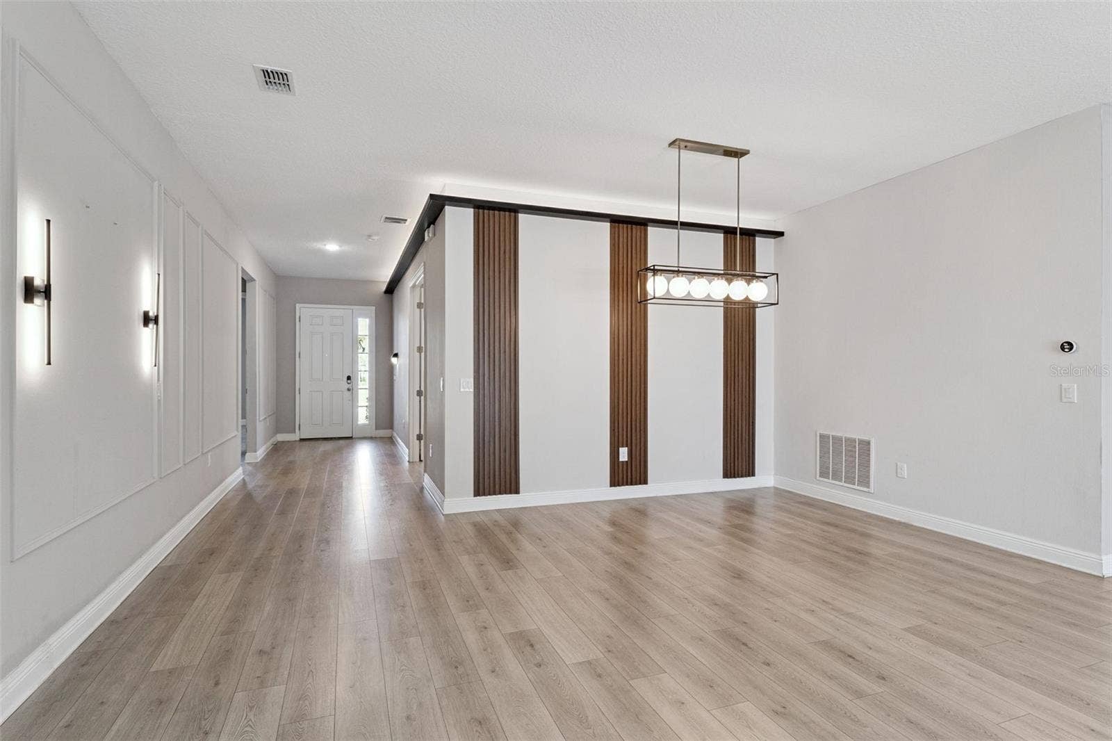 19058 PLANETREE STREET, Orlando, FL 32827 Spacious dining area with an open layout and modern finishes.