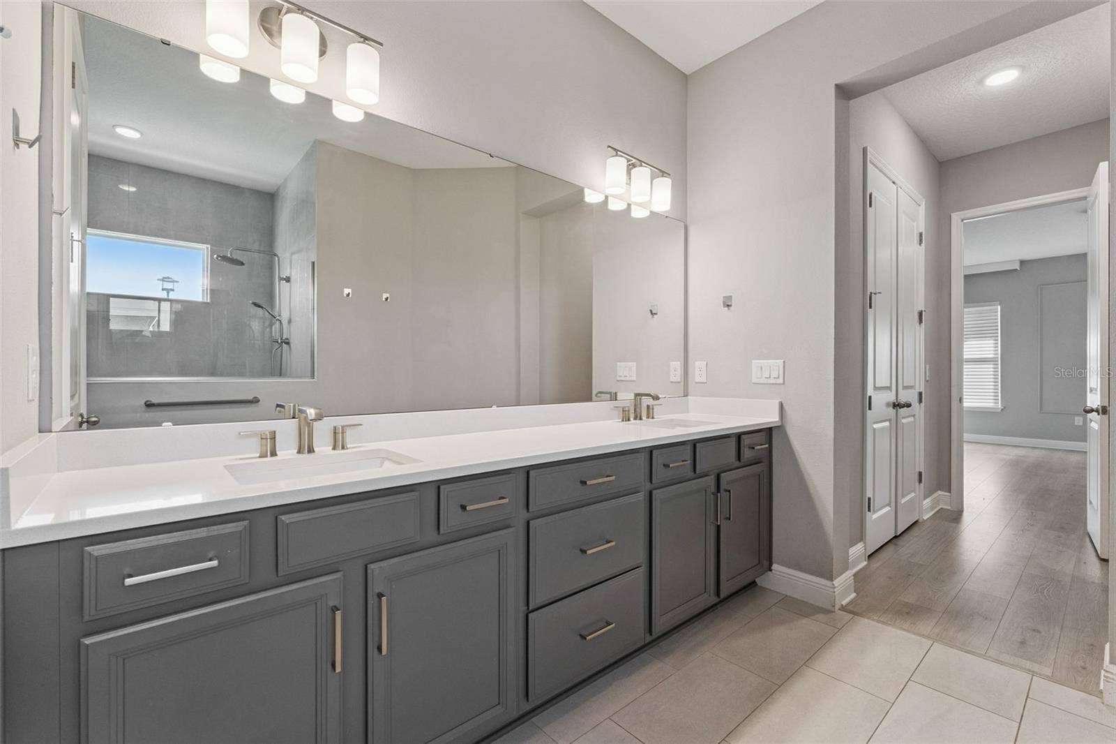 19058 PLANETREE STREET, Orlando, FL 32827 Primary bathroom featuring generous vanity space and modern finishes.