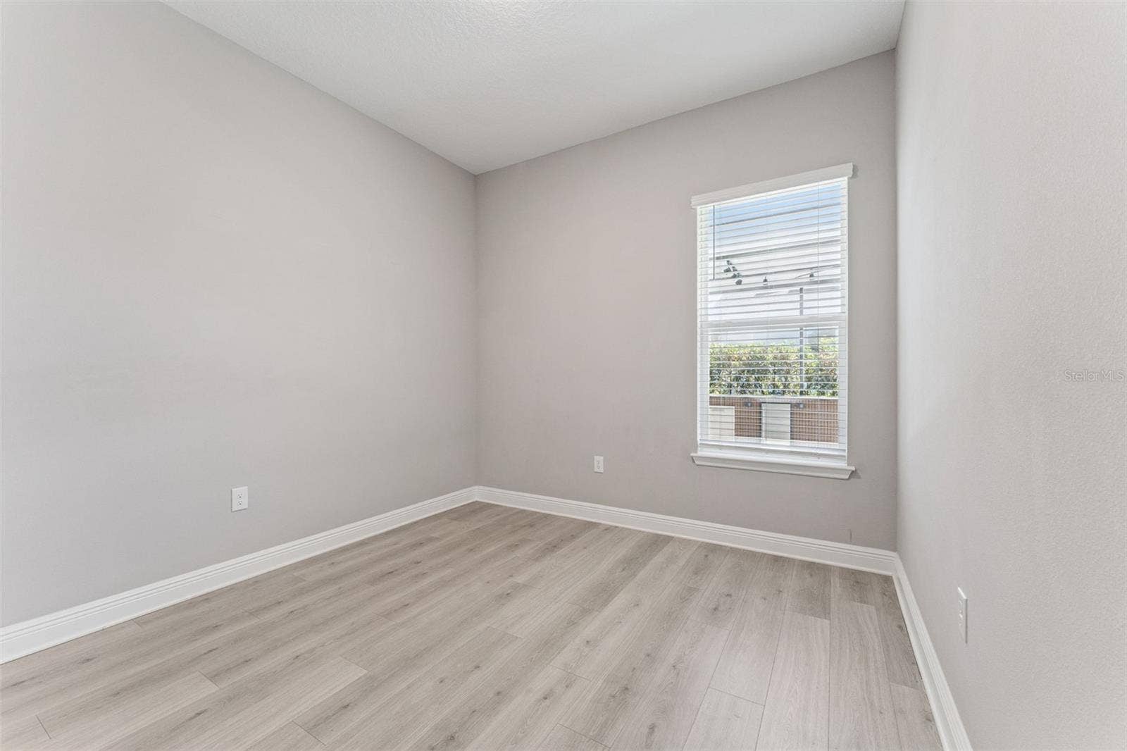 19058 PLANETREE STREET, Orlando, FL 32827 Versatile secondary bedroom with plenty of space for a home office, gym, or playroom.