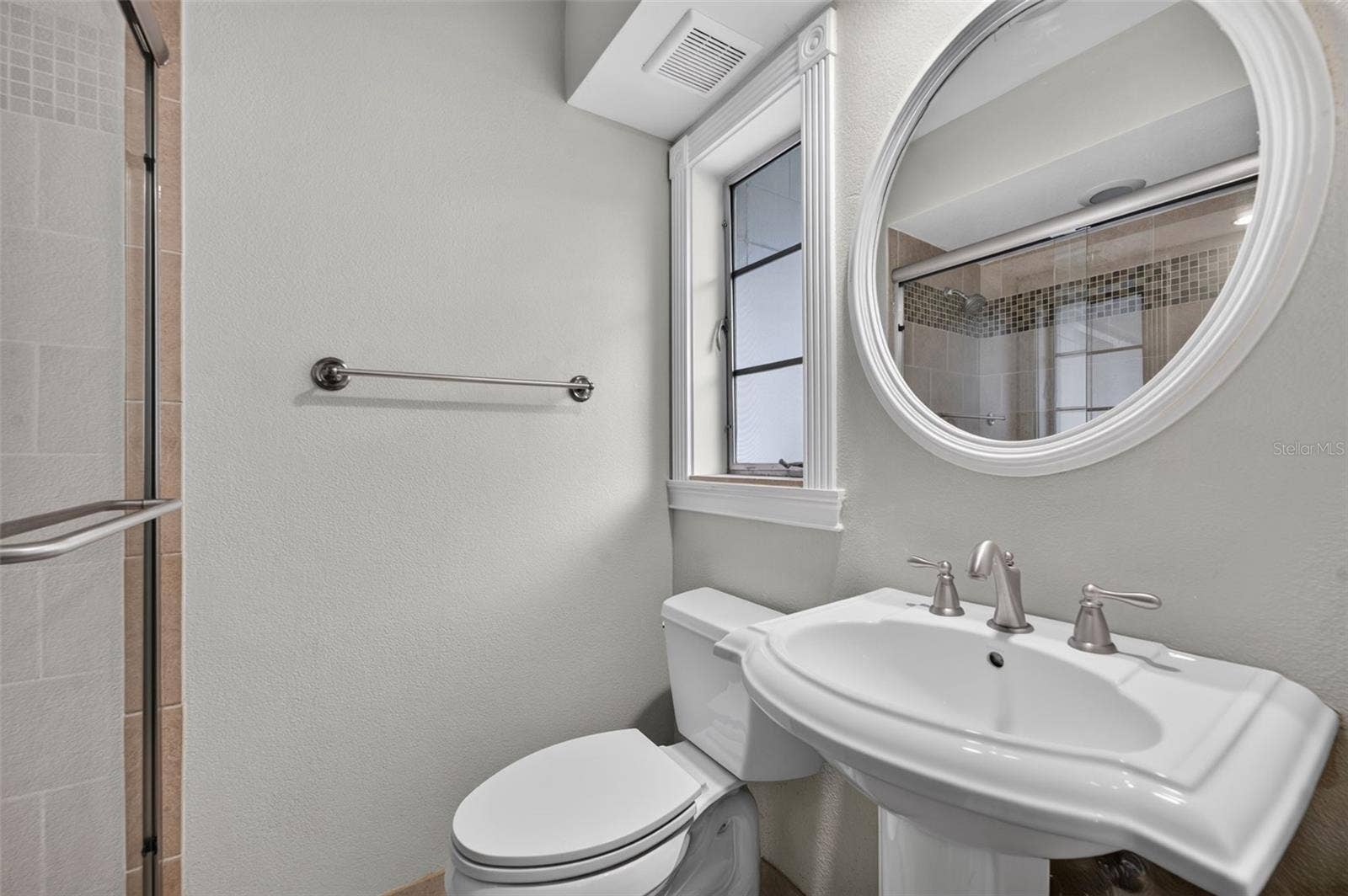 200 SENECA TRAIL, Maitland, FL 32751 Primary Bath En suite primary bathroom with pedestal sink and glass-enclosed shower.
