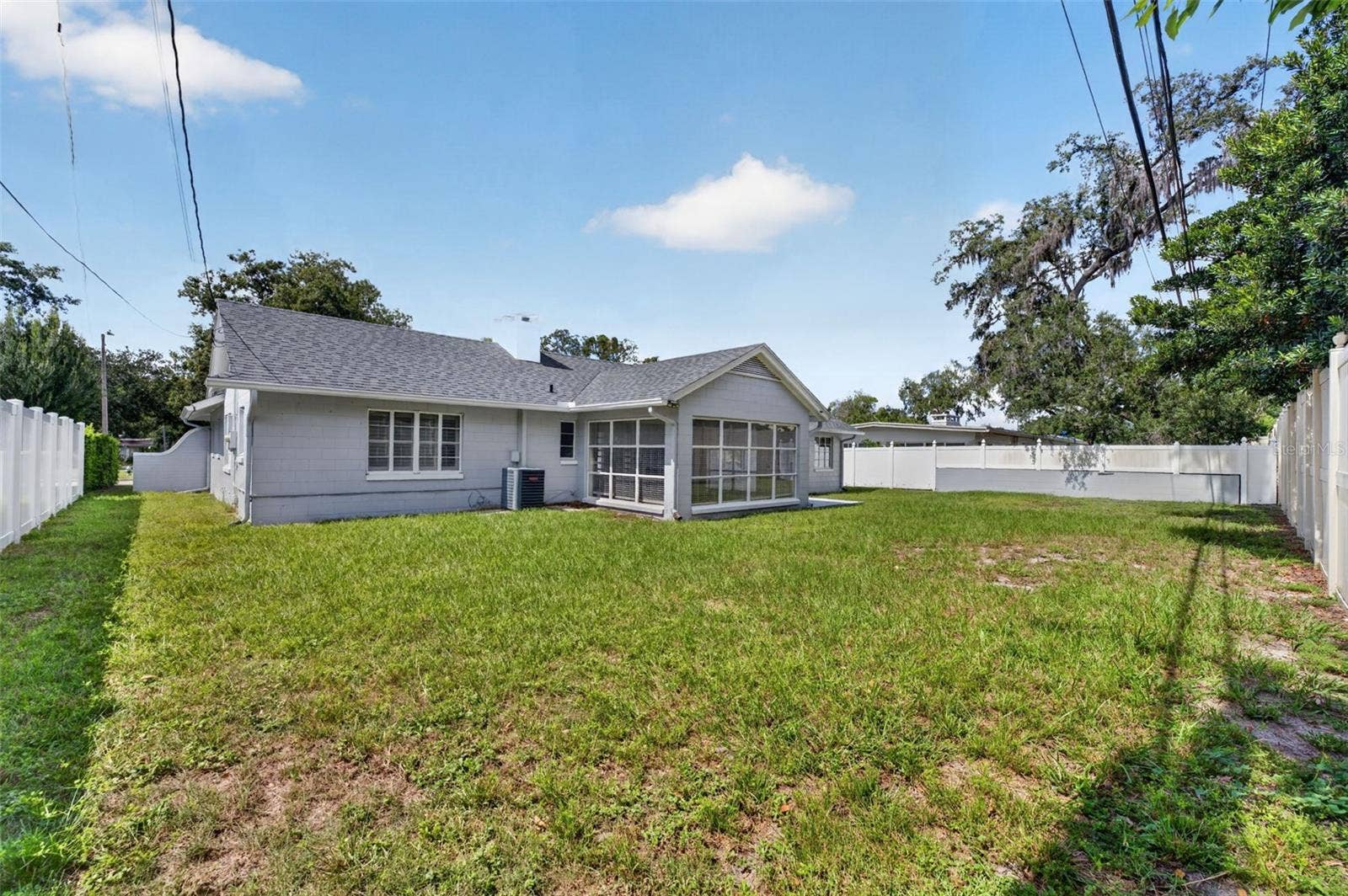 200 SENECA TRAIL, Maitland, FL 32751 Rear Exterior Generous fenced backyard with open lawn and plenty of room for outdoor enjoyment.