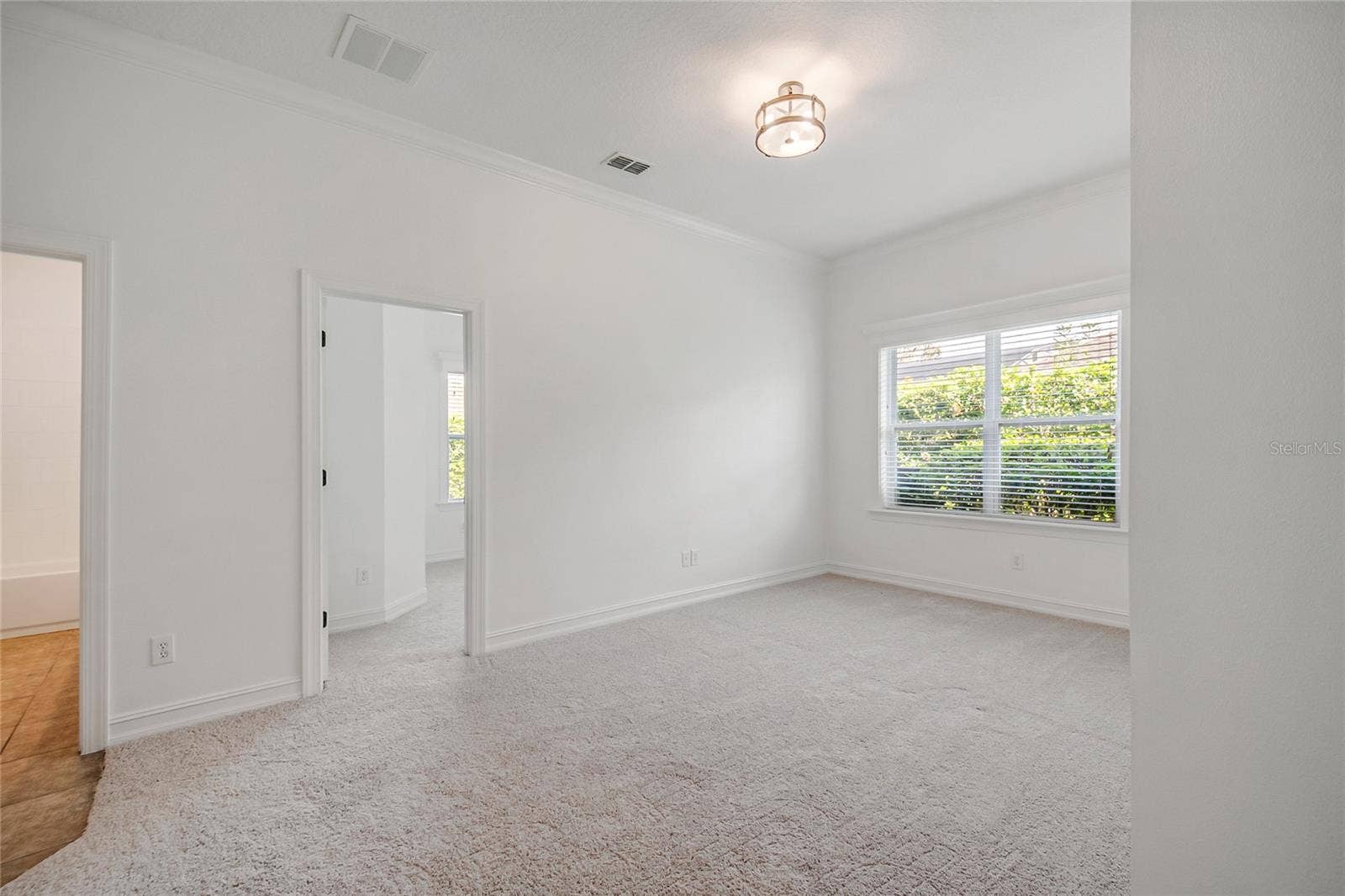 4244 ISLE VISTA AVENUE, Belle Isle, FL 32812 BONUS DEN RETREAT, OFFICE SPACE OR PLAYROOM FOR KIDS DOWSTAIRS