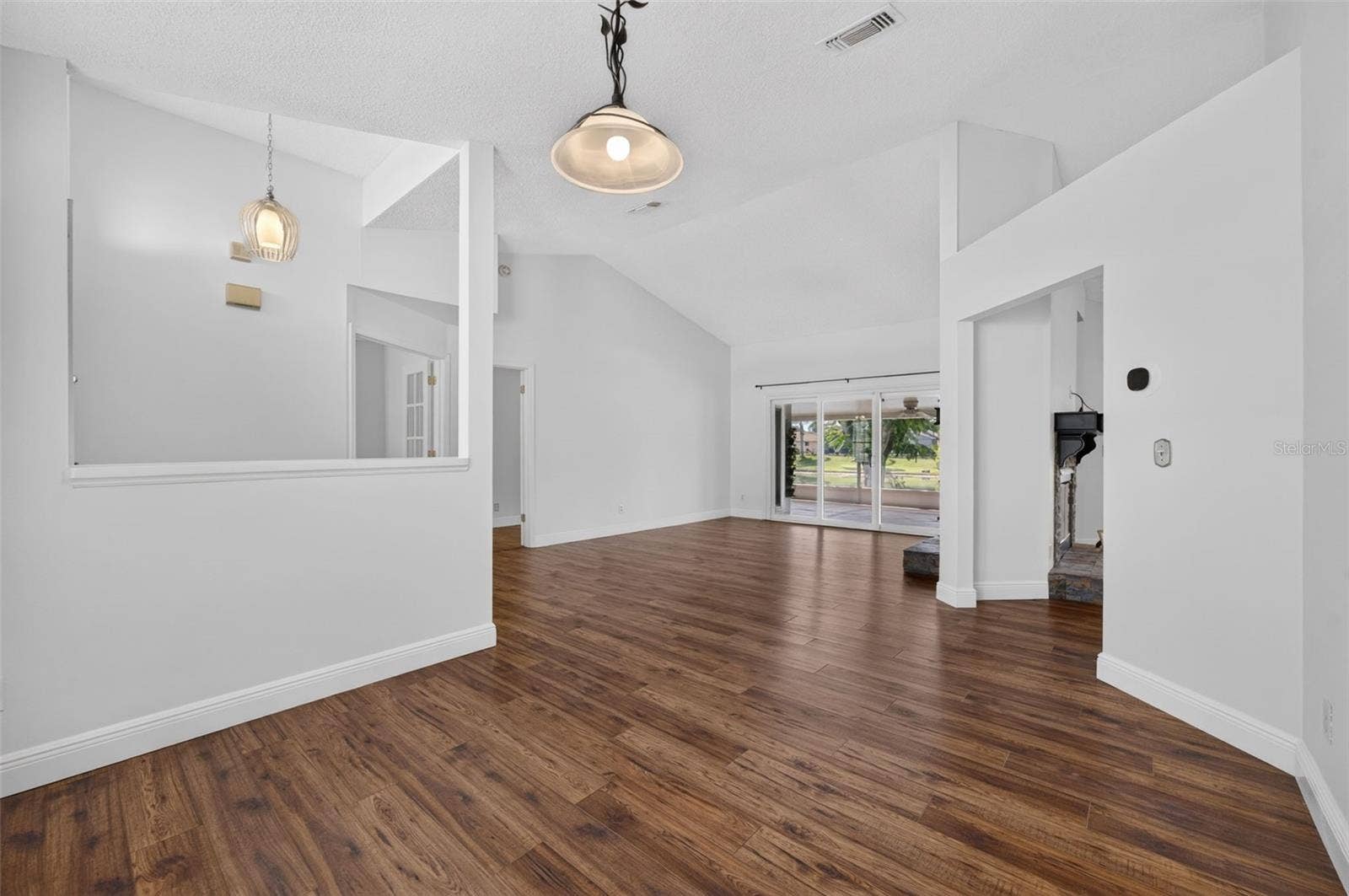 The formal dining room that opens to the formal living room.