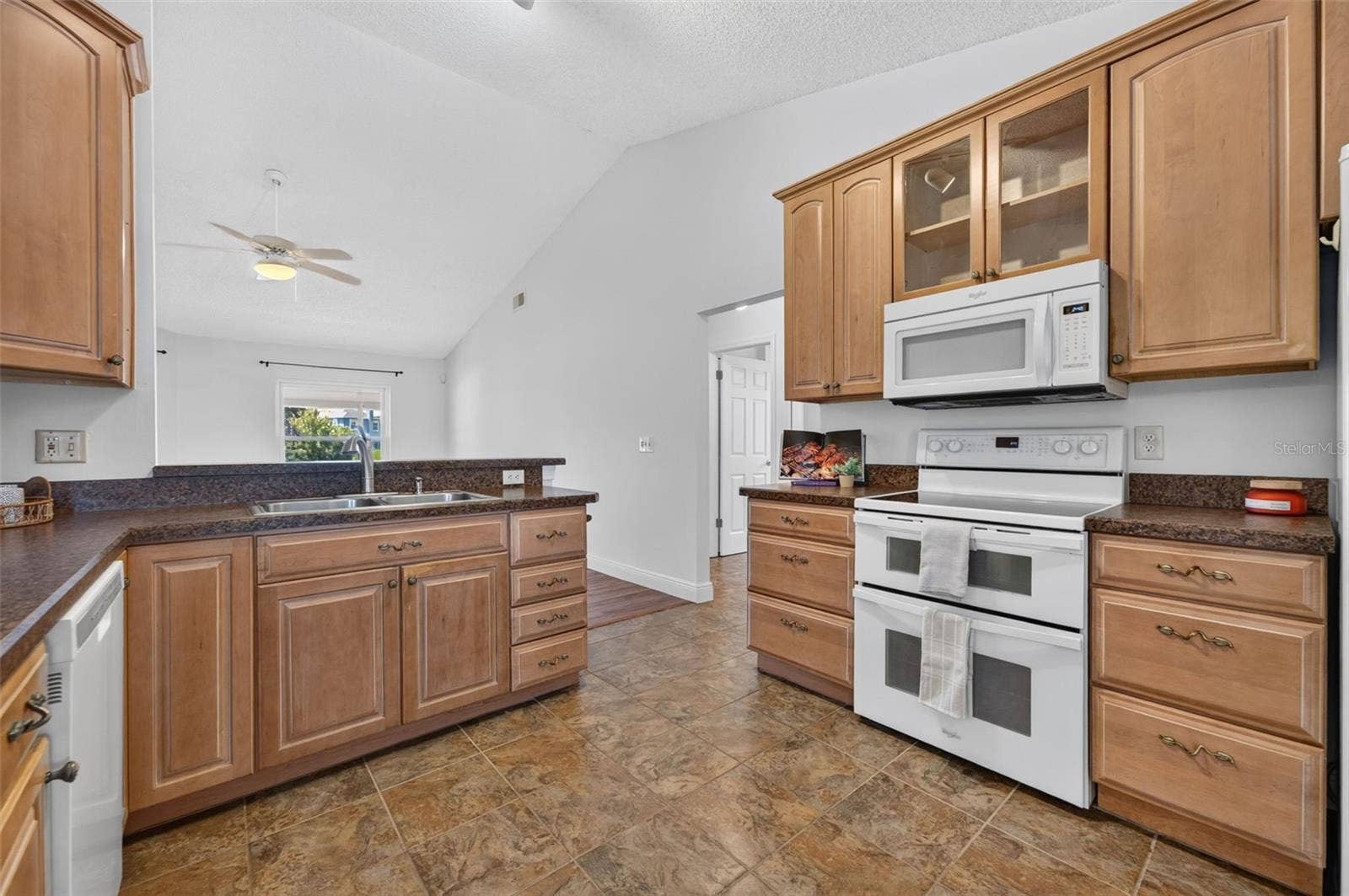 The kitchen offers ample storage.