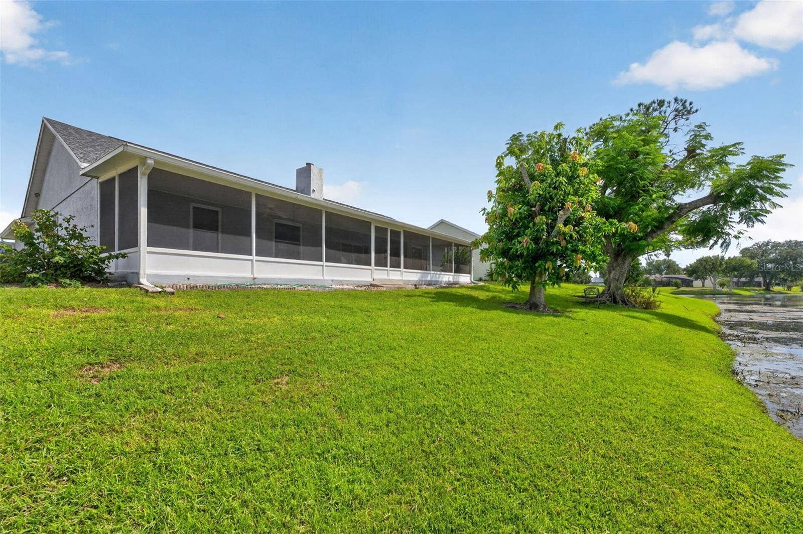 Even a fruit producing manago tree adds to the beauty of this homesite.