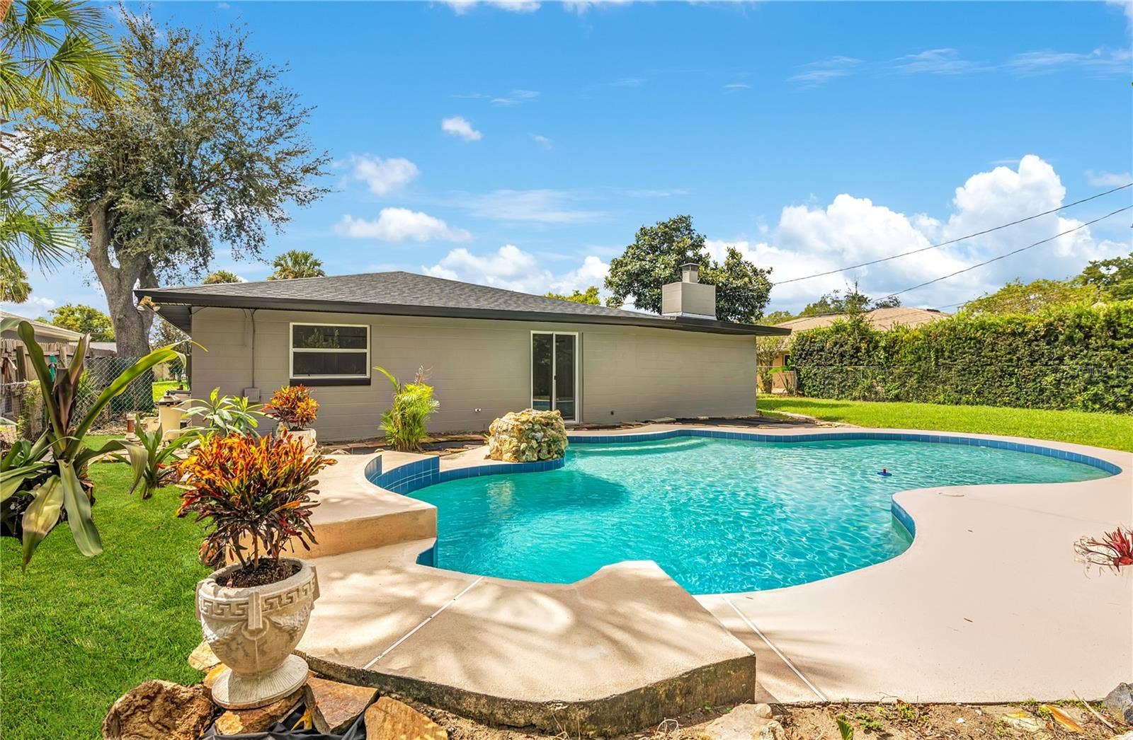 4415 HAYLOCK DRIVE, Orlando, FL 32807 Pool with stone water-feature