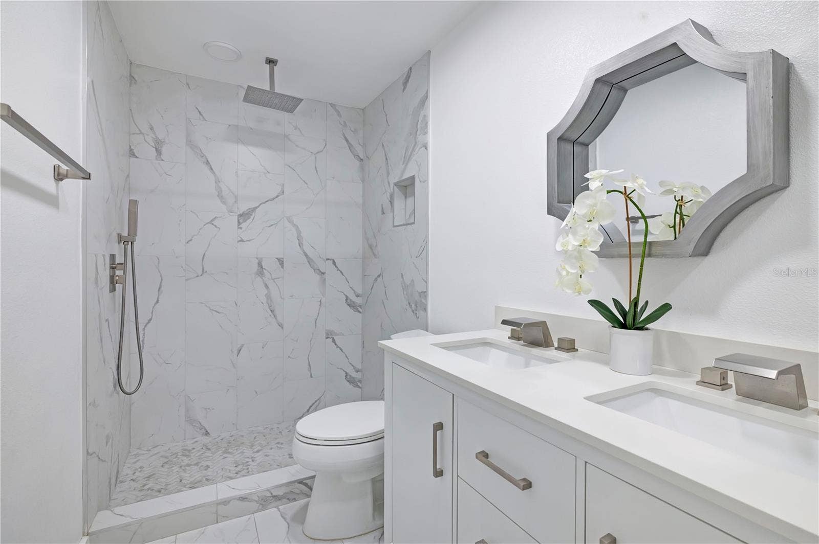4415 HAYLOCK DRIVE, Orlando, FL 32807 Fully renovated bathroom with double sinks and rain shower head
