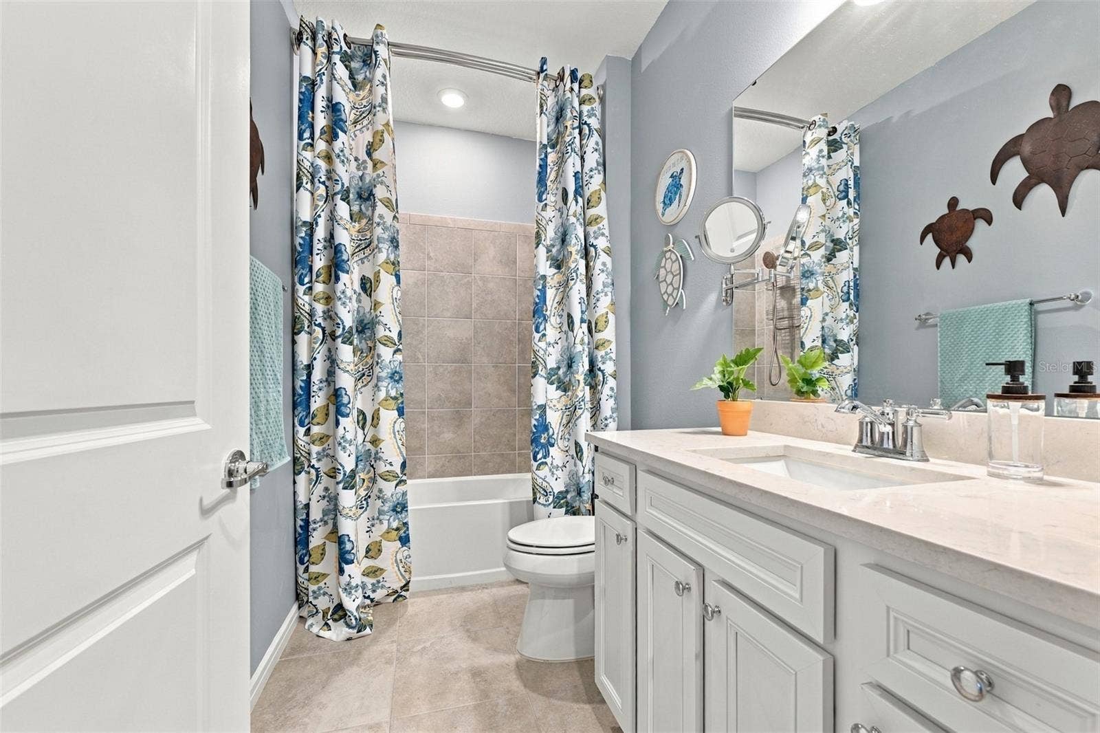 9260 BALLASTER POINTE LOOP, Parrish, FL 34219 2nd Bathroom decorater quartz, make up mirror, extra storage. Designer shower curtains are included!