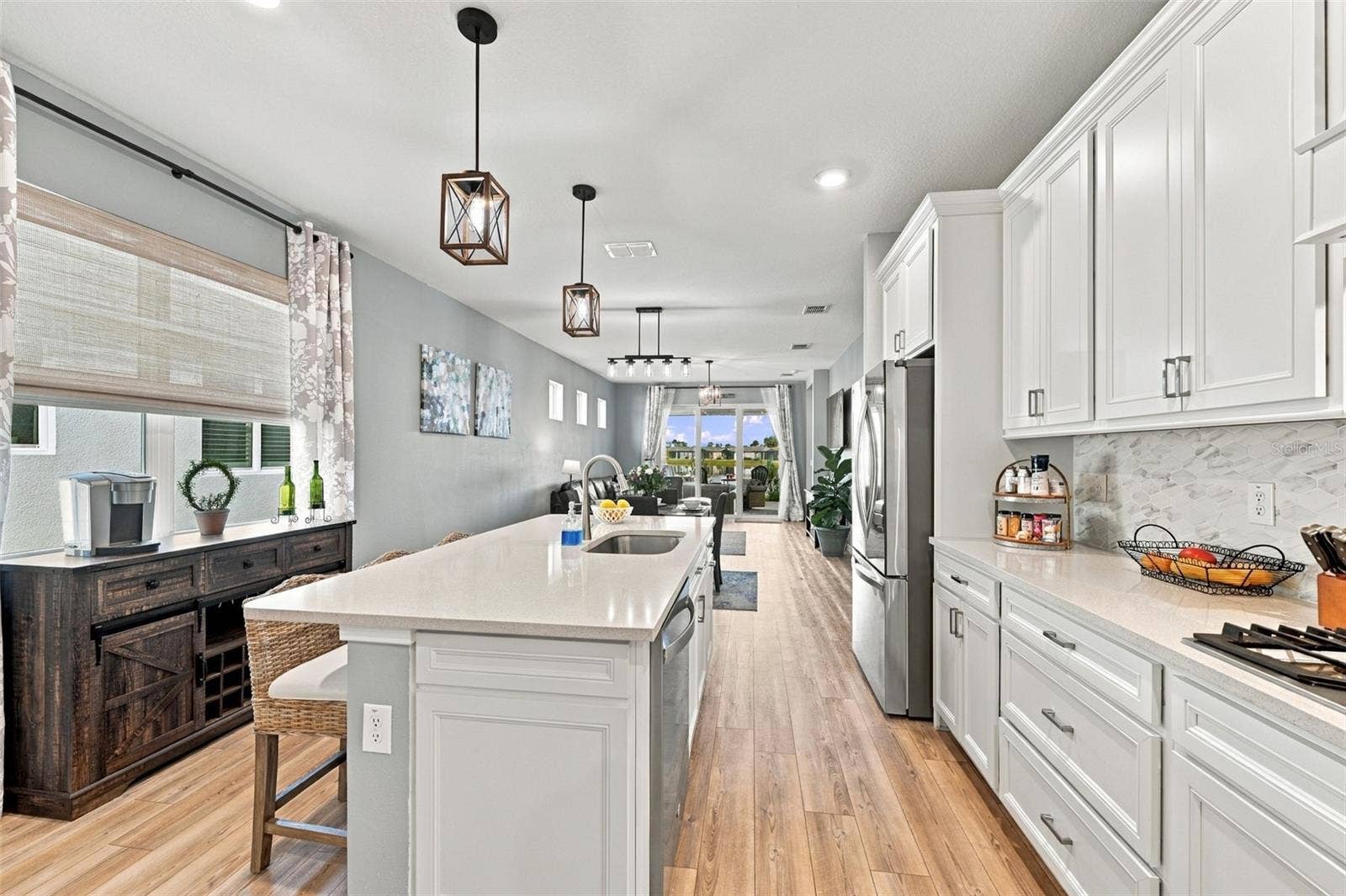 9260 BALLASTER POINTE LOOP, Parrish, FL 34219 This Bright Kitchen is situated toward the front of the house adorned by large double pane windows shades and curtains included!
