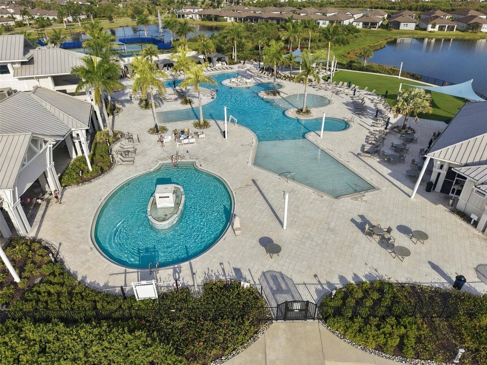 9260 BALLASTER POINTE LOOP, Parrish, FL 34219 Multiple pools, sun shelf, covered cabanas add to this Luxury Adult Lifestyle.