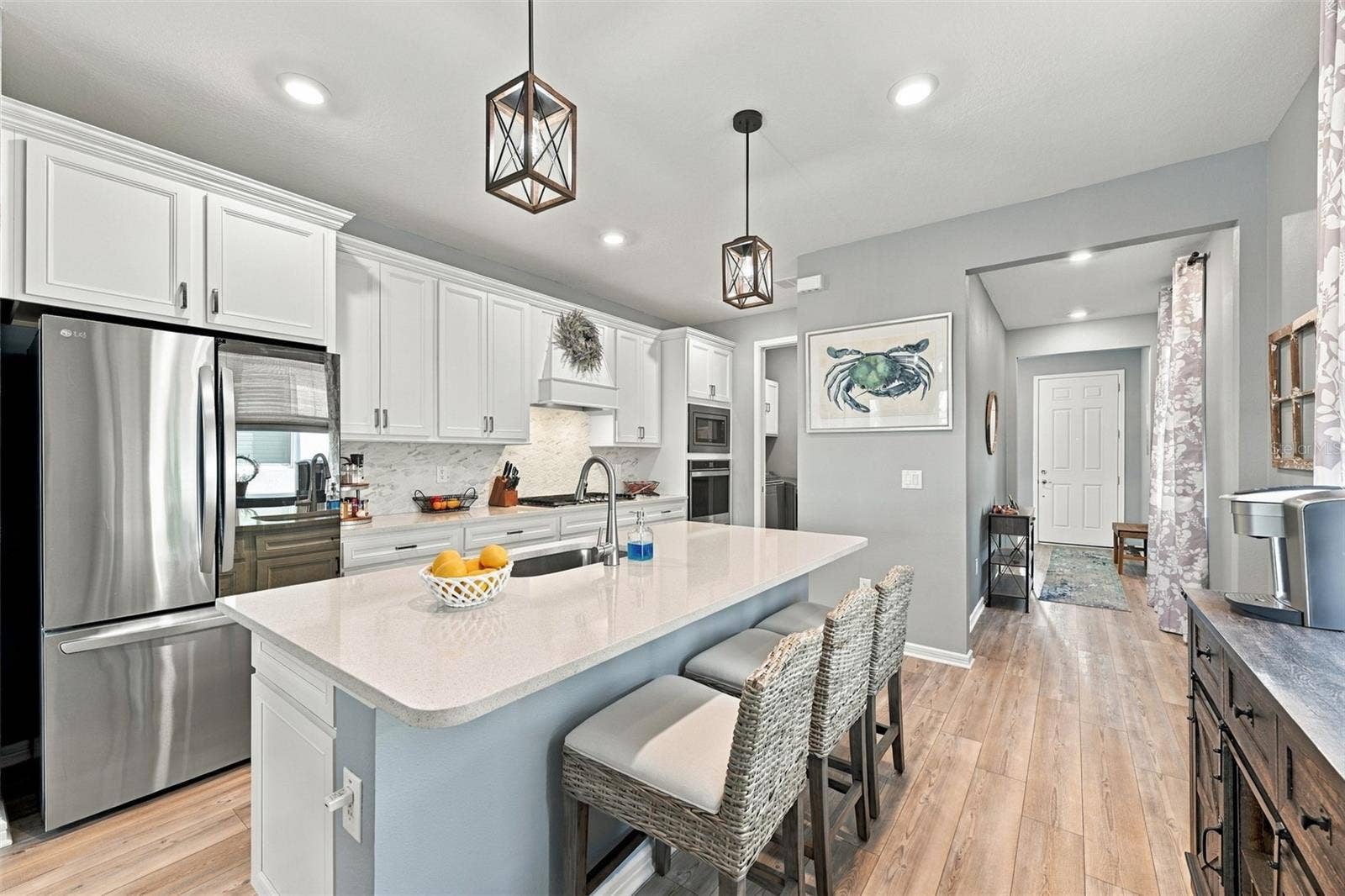 9260 BALLASTER POINTE LOOP, Parrish, FL 34219 The newer top of the line appliances include a transparent glass LG Refrigerator with Ice Maker, Double Wall Microwave/Oven and Gas Stove.