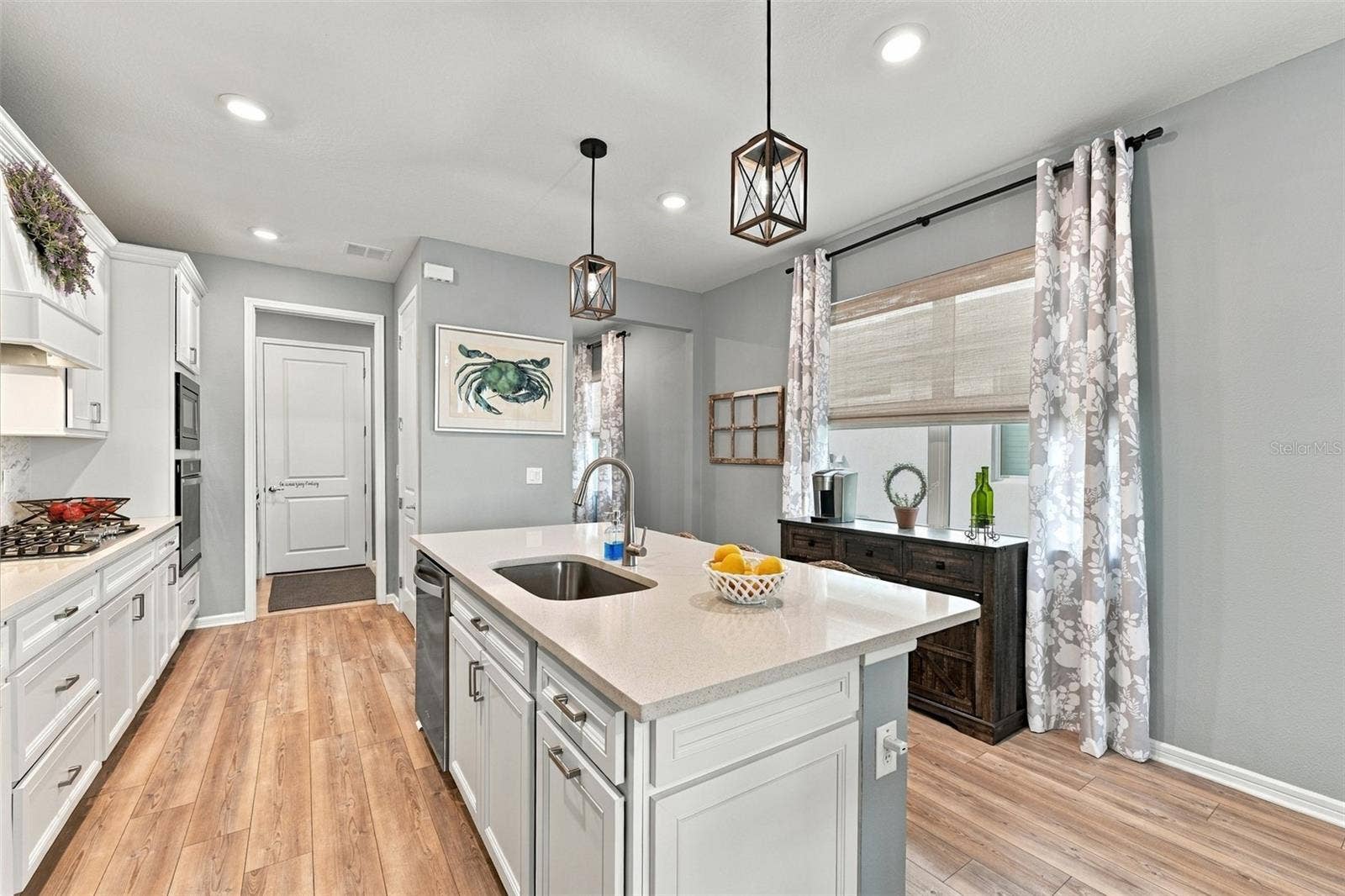 9260 BALLASTER POINTE LOOP, Parrish, FL 34219 Single Bowl sink, trash drawer and dishwasher island add to this functional kitchen!