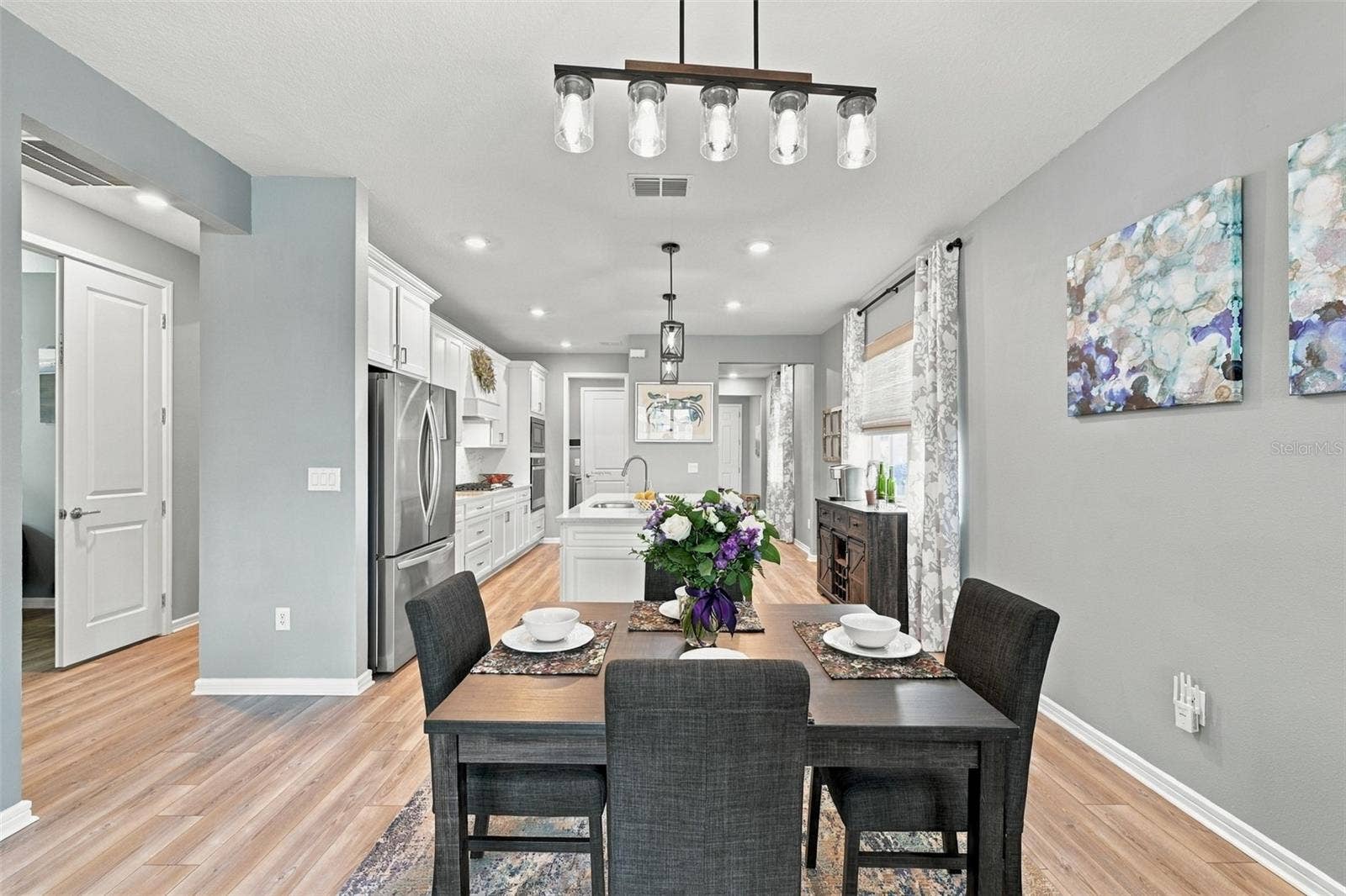 9260 BALLASTER POINTE LOOP, Parrish, FL 34219 Hallway to the 2nd and 3rd bedrooms and full bathroom.