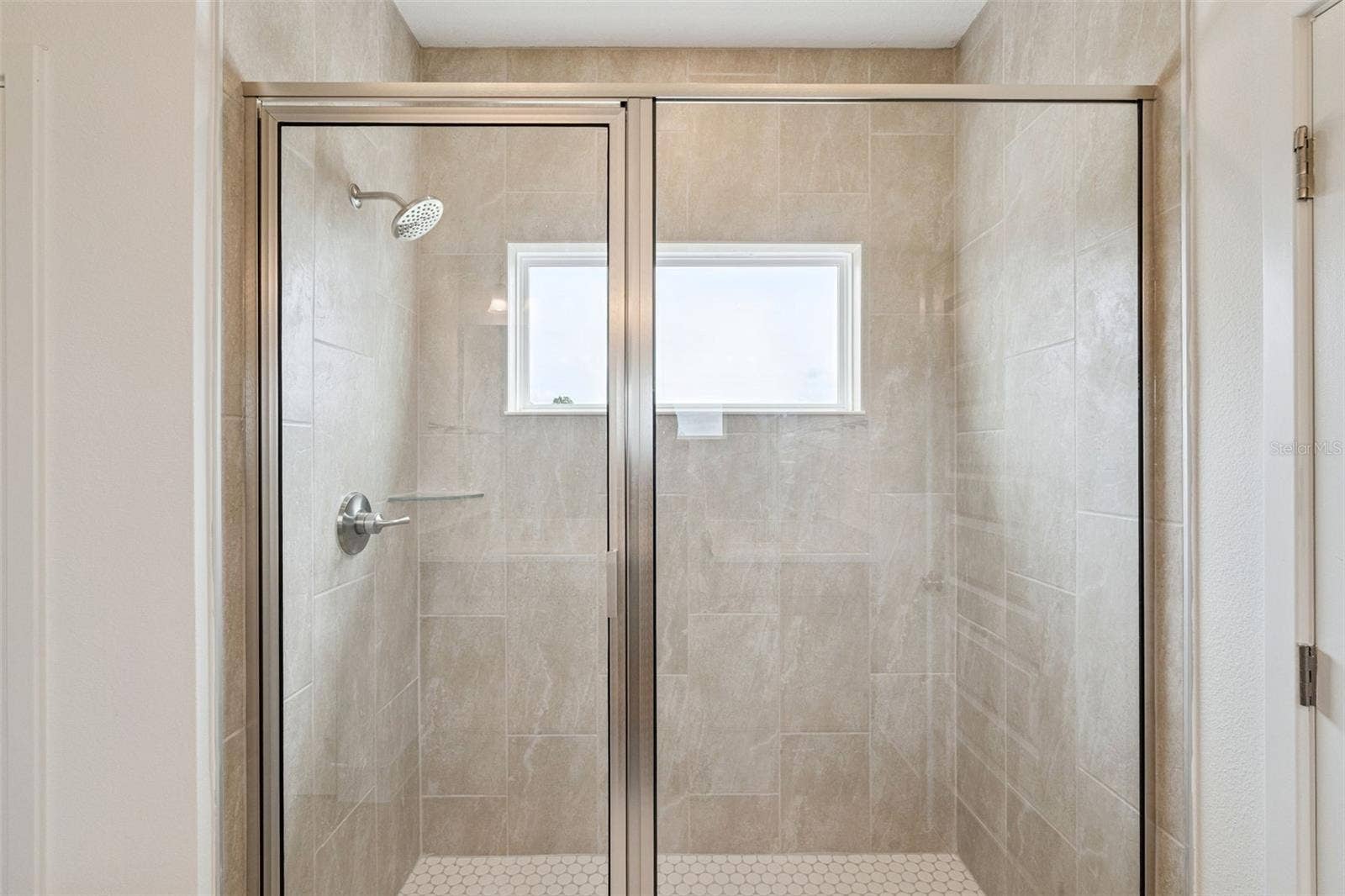 17602 JAPONICA BLOOM DRIVE, Winter Garden, FL 34787 Representative photo secondary bathroom
