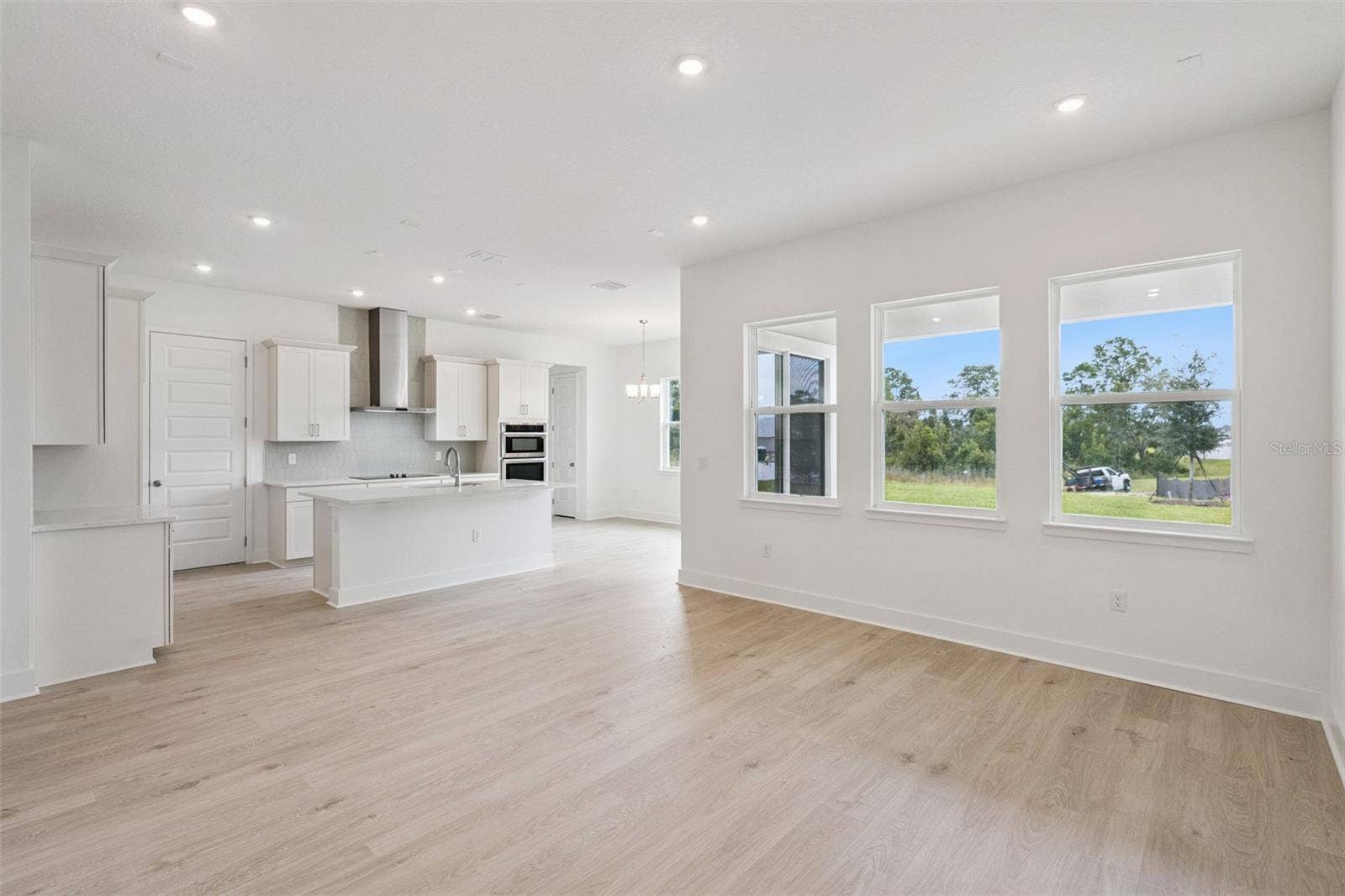 17602 JAPONICA BLOOM DRIVE, Winter Garden, FL 34787 Representative photo living/kitchen