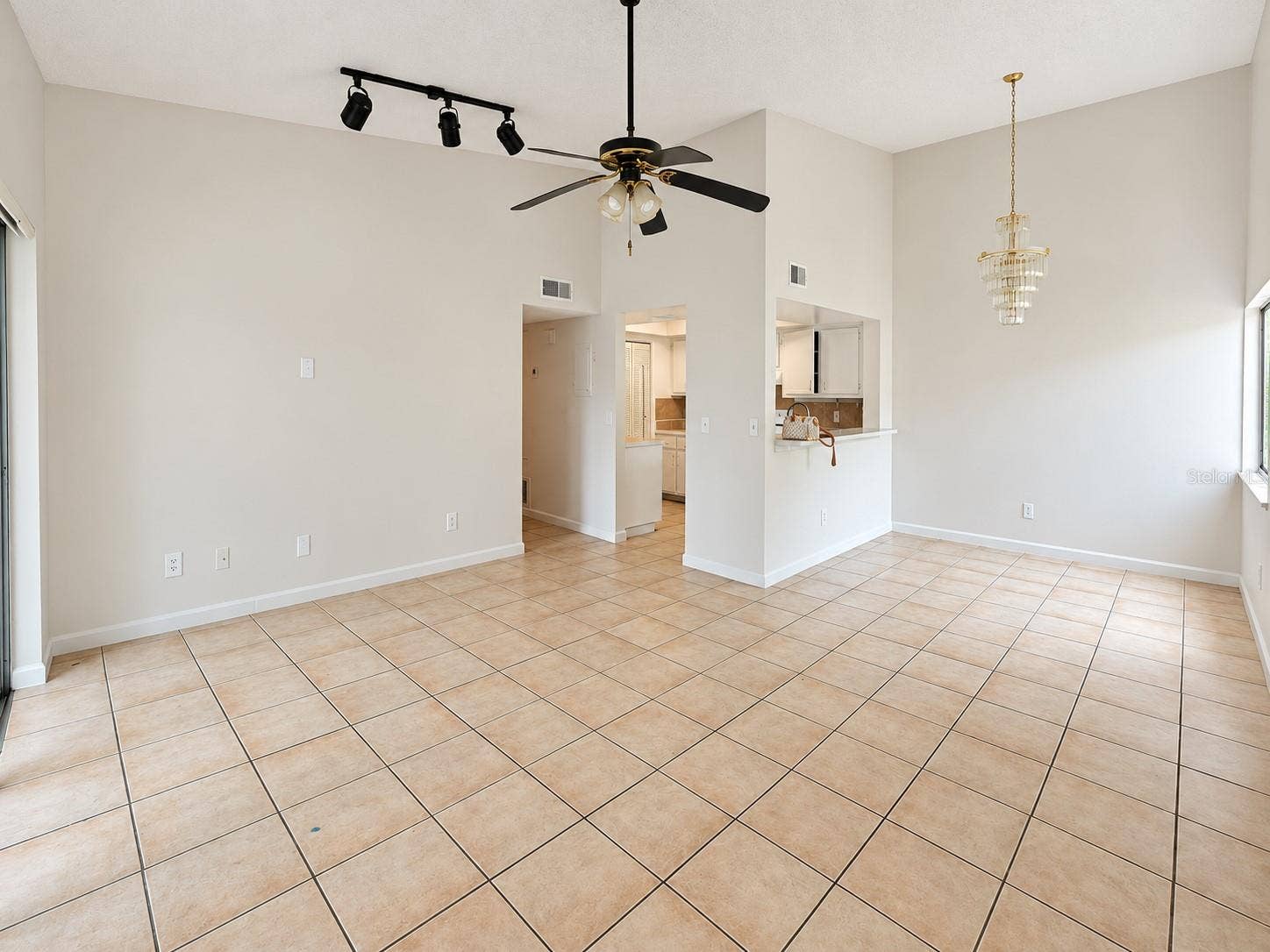 2527 CITRUS CLUB LANE, #3904, Orlando, FL 32839 Spacious living and dining viewed from entry.