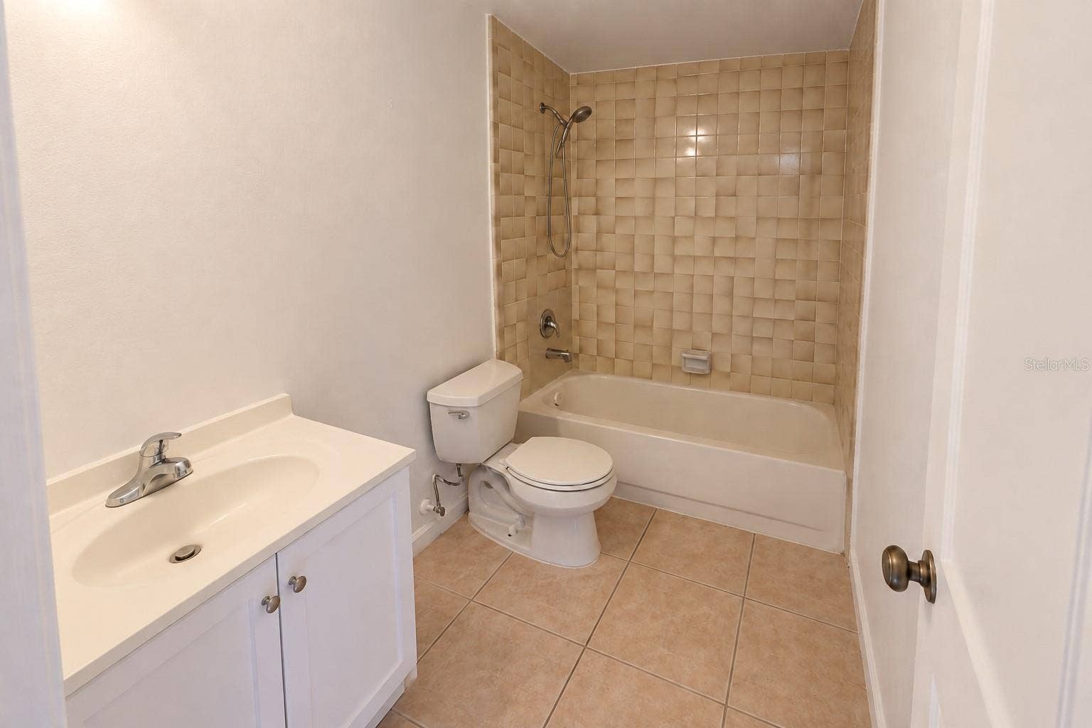 2527 CITRUS CLUB LANE, #3904, Orlando, FL 32839 Bathroom 2 with updated shower enclosure and vanity.