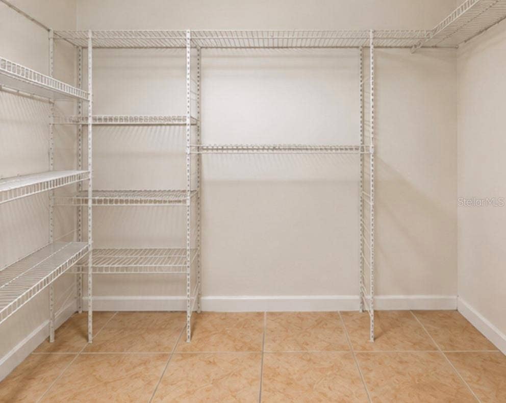 2527 CITRUS CLUB LANE, #3904, Orlando, FL 32839 Spacious walk-in closet with added shelving.
