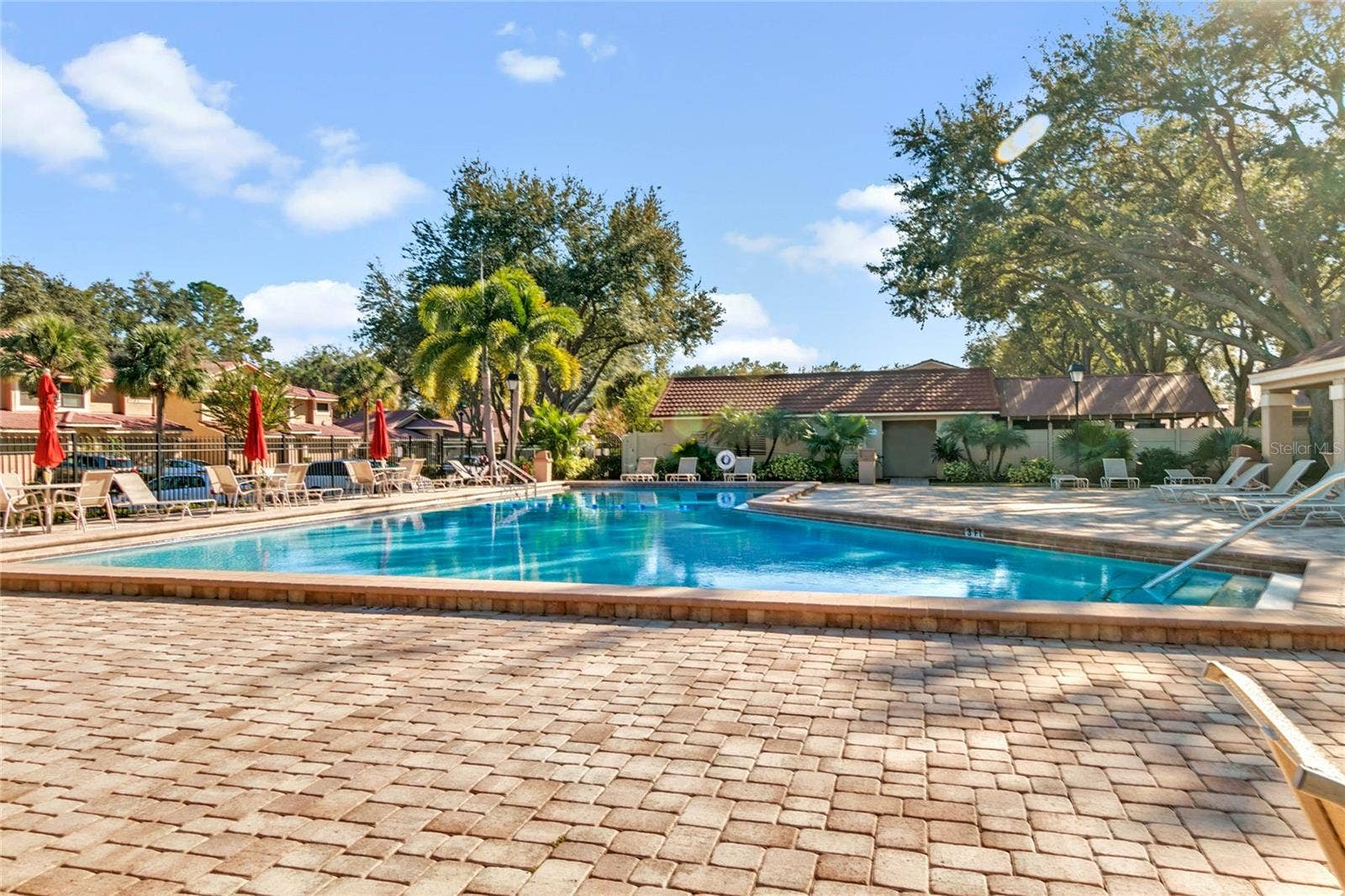 8235 AMBROSE COVE WAY, Orlando, FL 32819 Community pool for a refreshing break close to home.