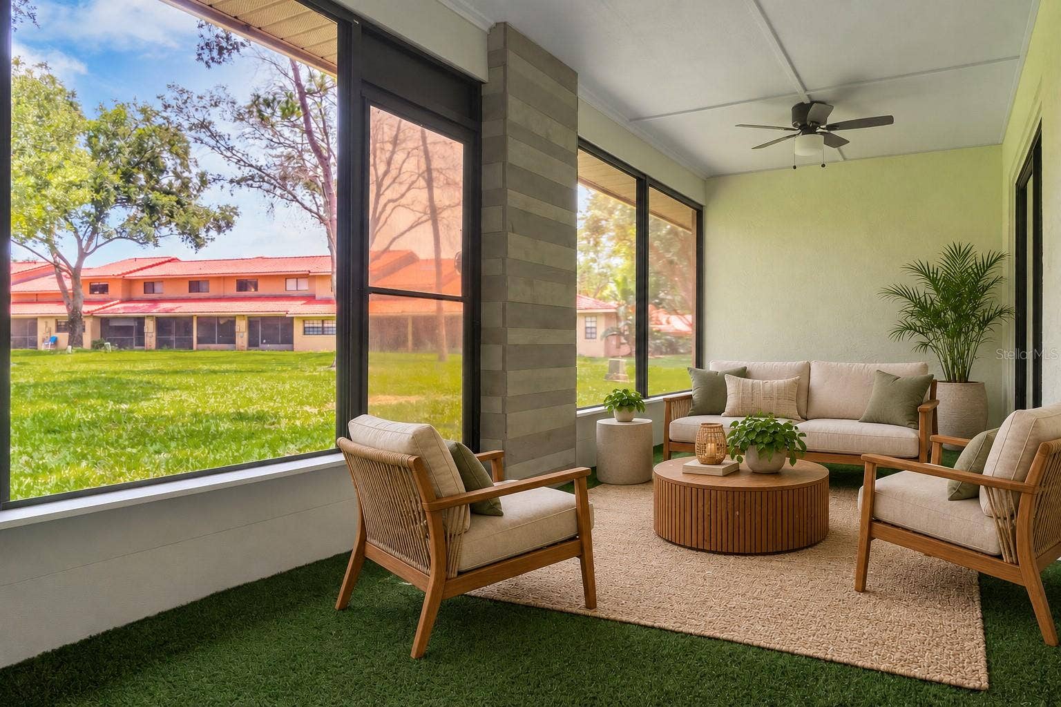 8235 AMBROSE COVE WAY, Orlando, FL 32819 Sunroom with plenty of sunlight overlooking the green space.