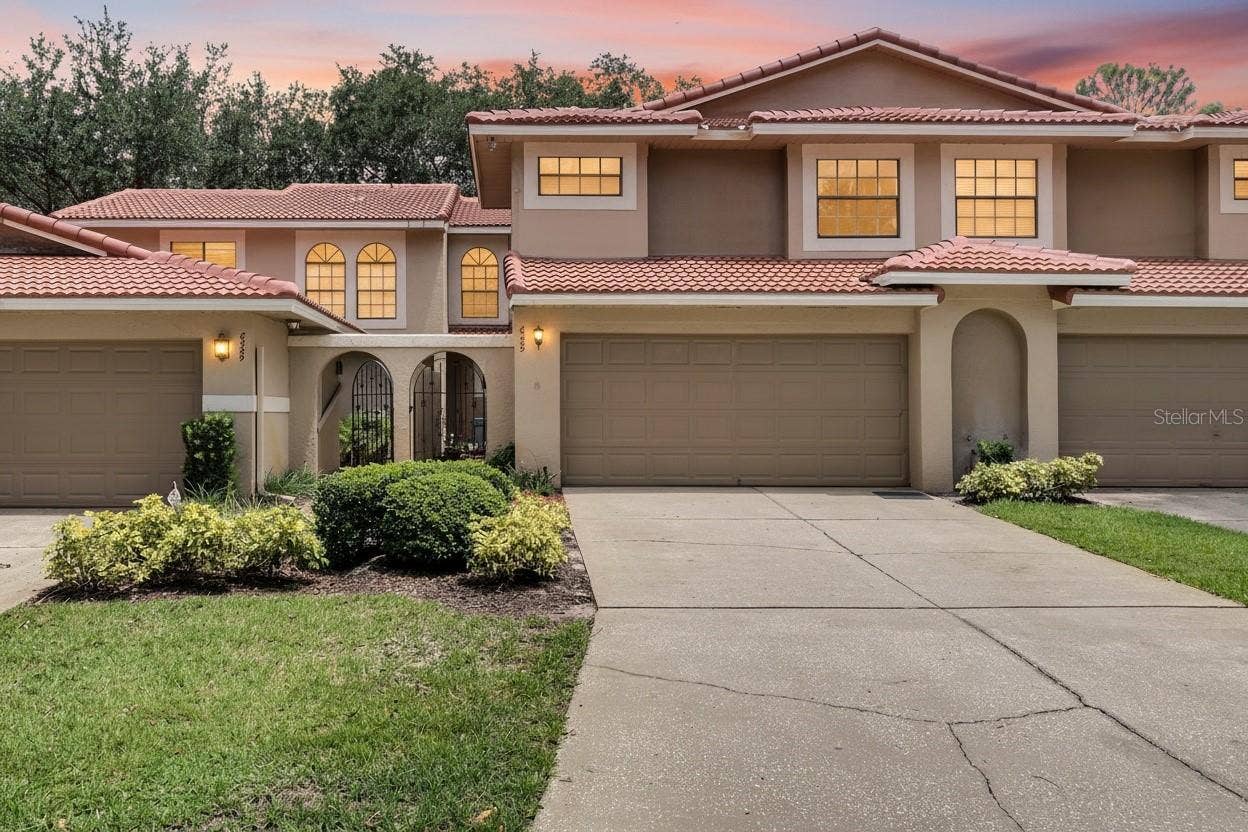 8235 AMBROSE COVE WAY, Orlando, FL 32819 Private entry and attached garage for convenient everyday access.