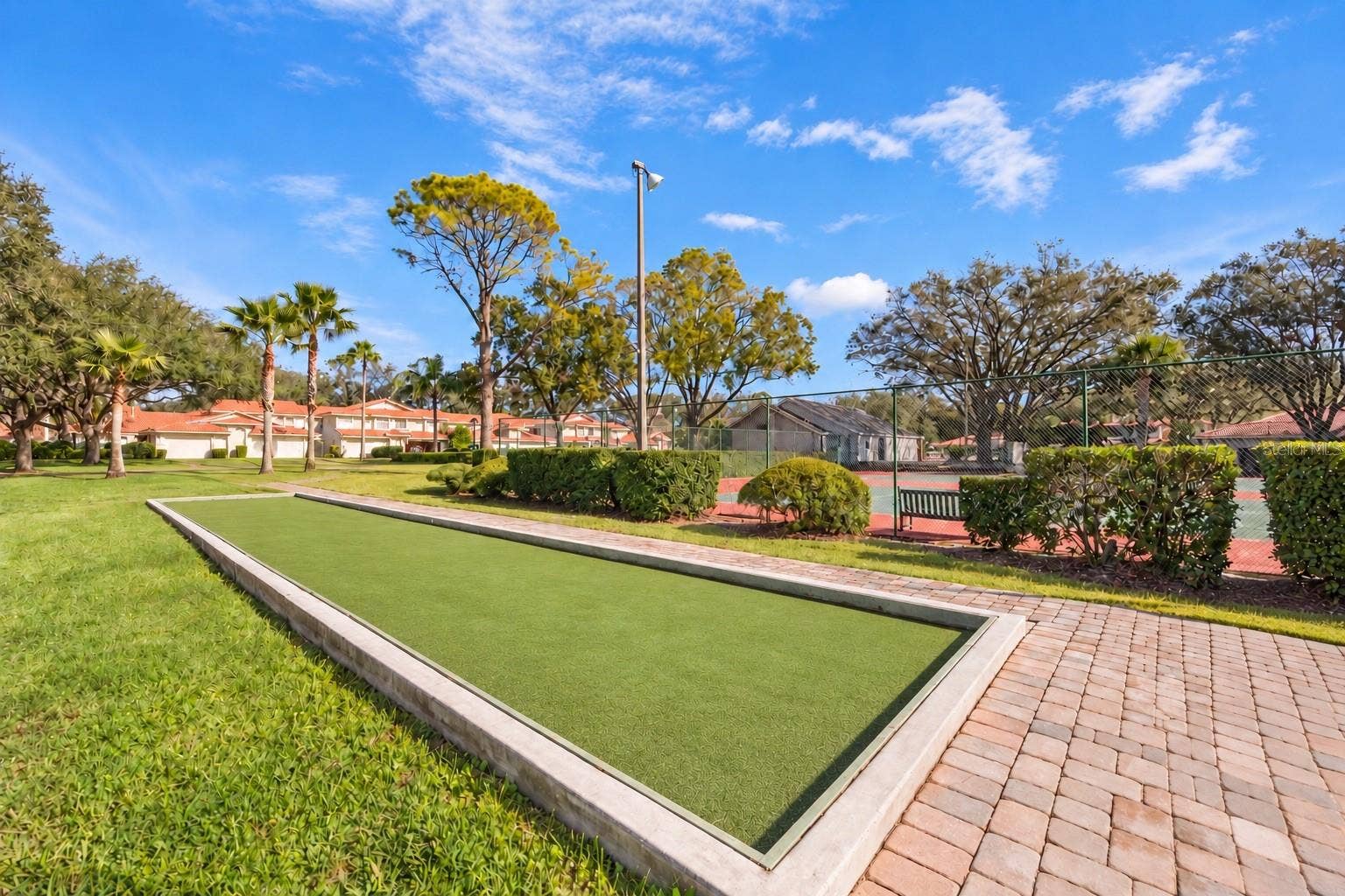8235 AMBROSE COVE WAY, Orlando, FL 32819 On-site bocce court adds another option for outdoor recreation.