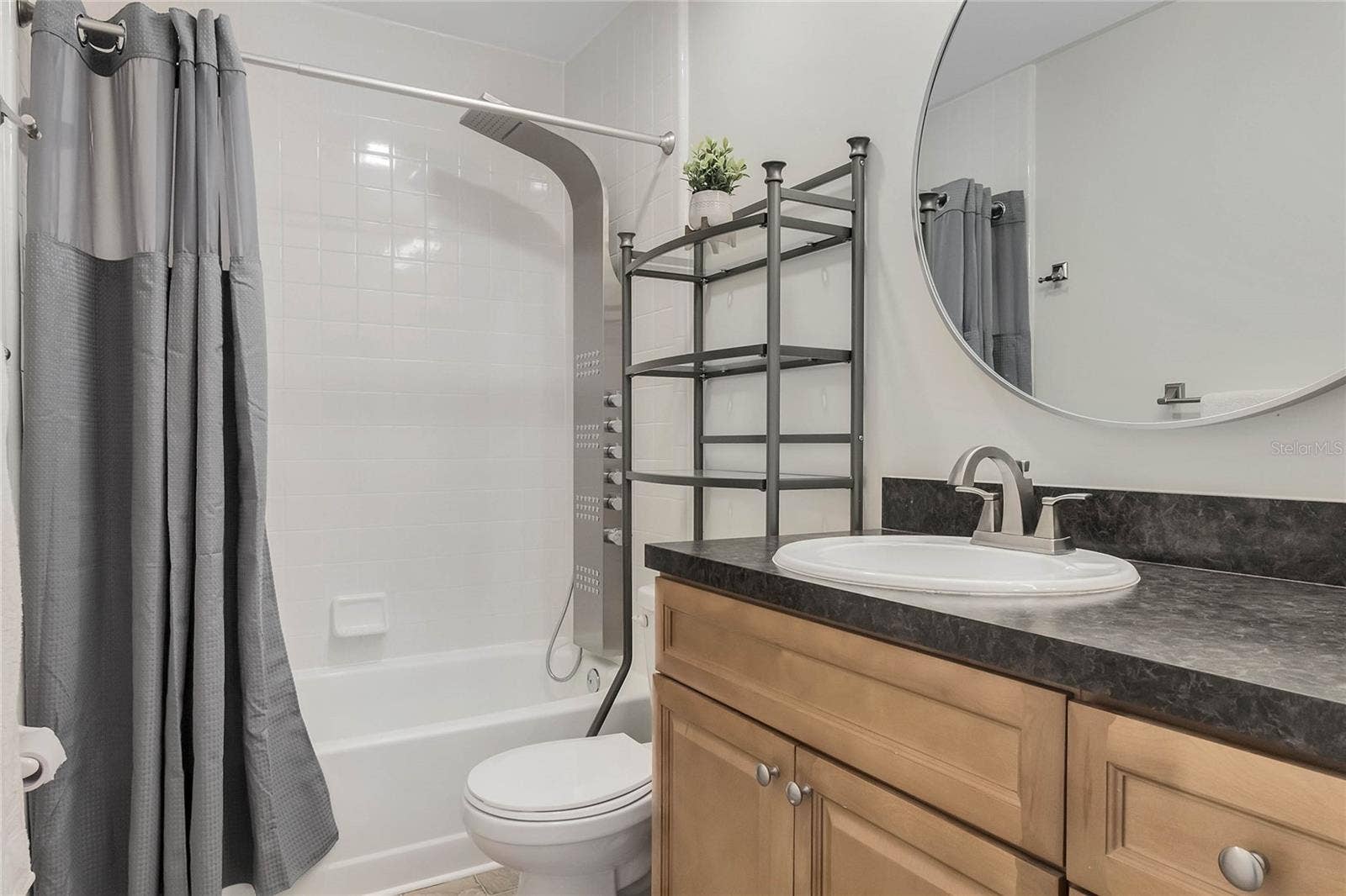 8235 AMBROSE COVE WAY, Orlando, FL 32819 Secondary bathroom upstairs with updated shower head