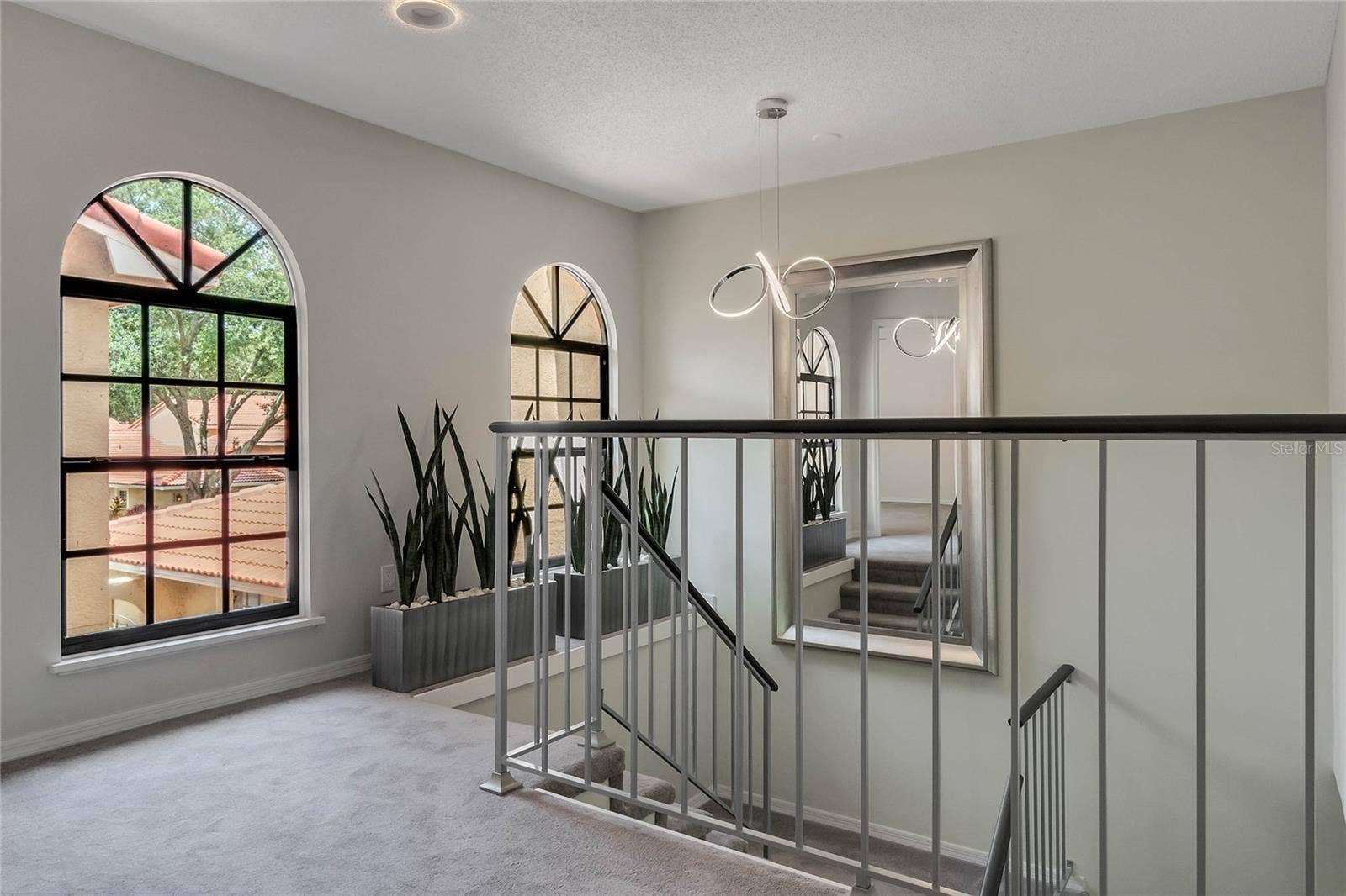 8235 AMBROSE COVE WAY, Orlando, FL 32819 Updated carpet and stairway railing