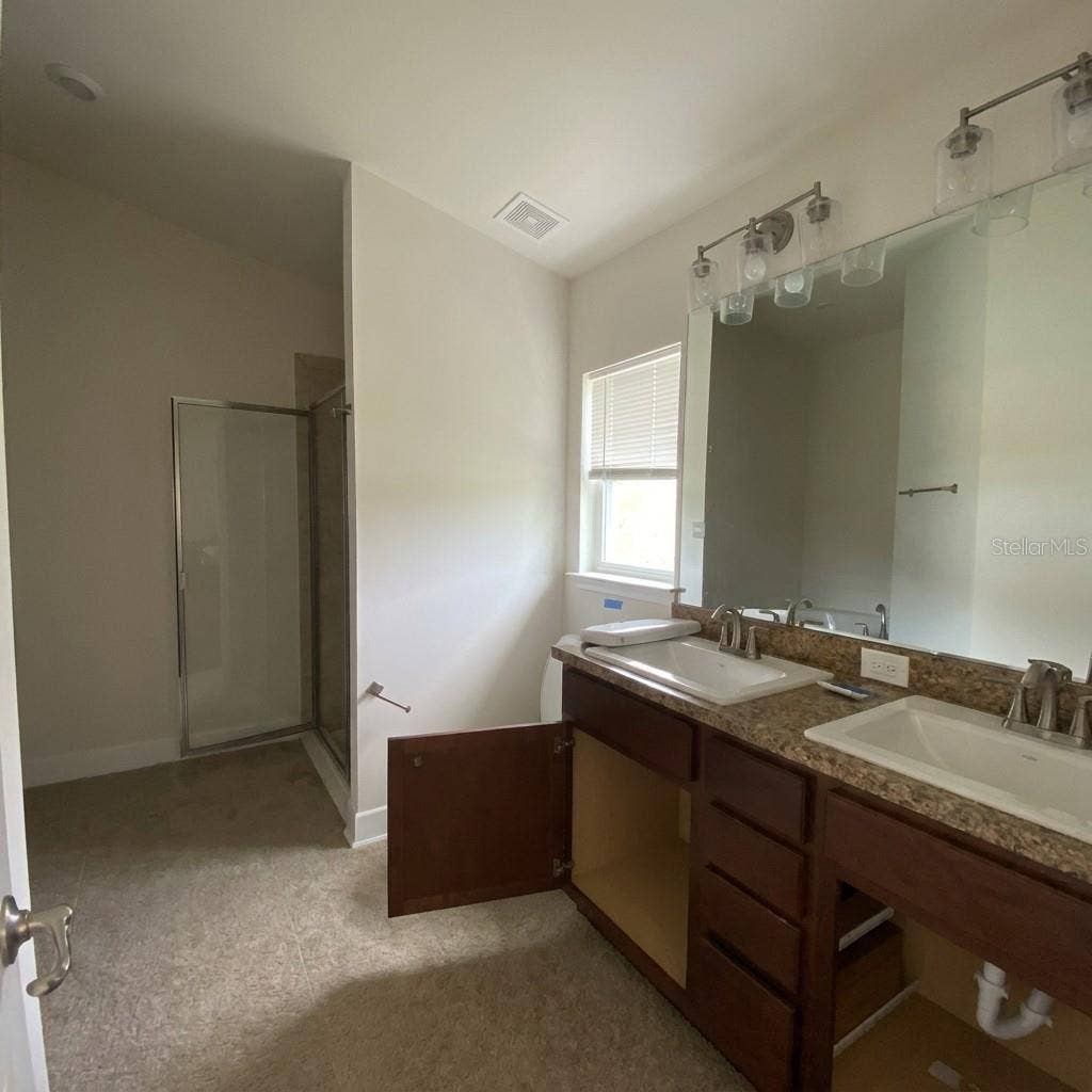 Primary En-Suite with Double Sink, Shower and Soaking Tub.