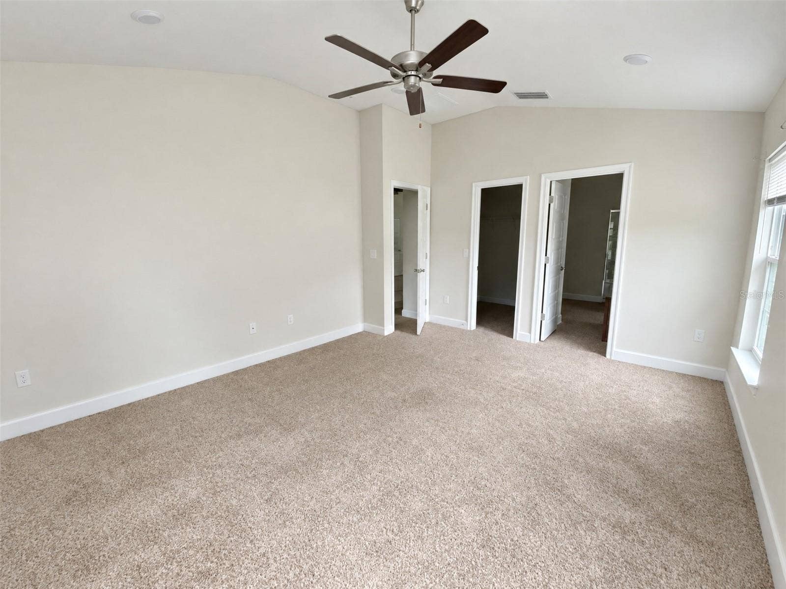 Primary Bed Room. View towards En-suite and Walk-In Closet