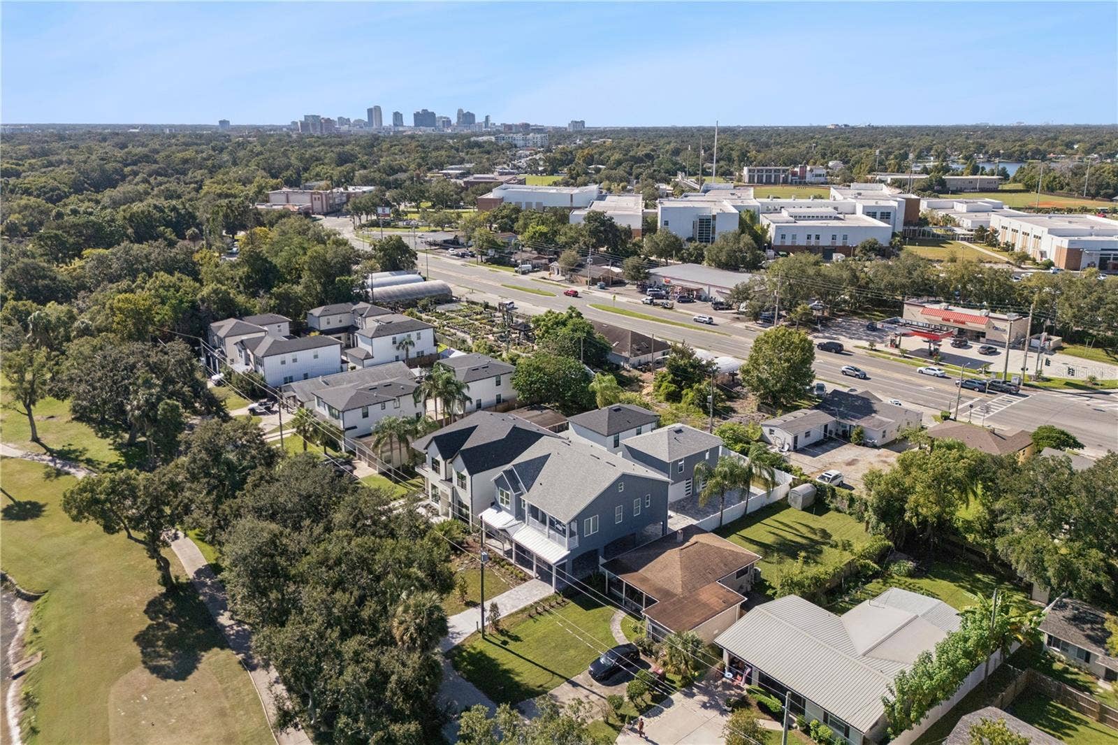 3456 FAIRWAY LANE, Orlando, FL 32804 An aerial view shows the home and surrounding neighborhood of College Park with Orlando in the background.