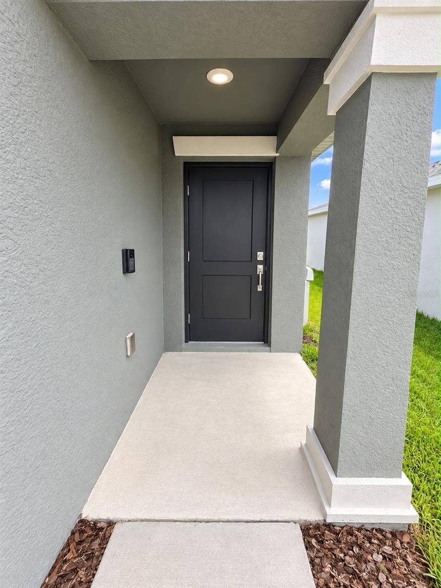 285 PINEYWOODS STREET, St Cloud, FL 34772 Covered Front Entry