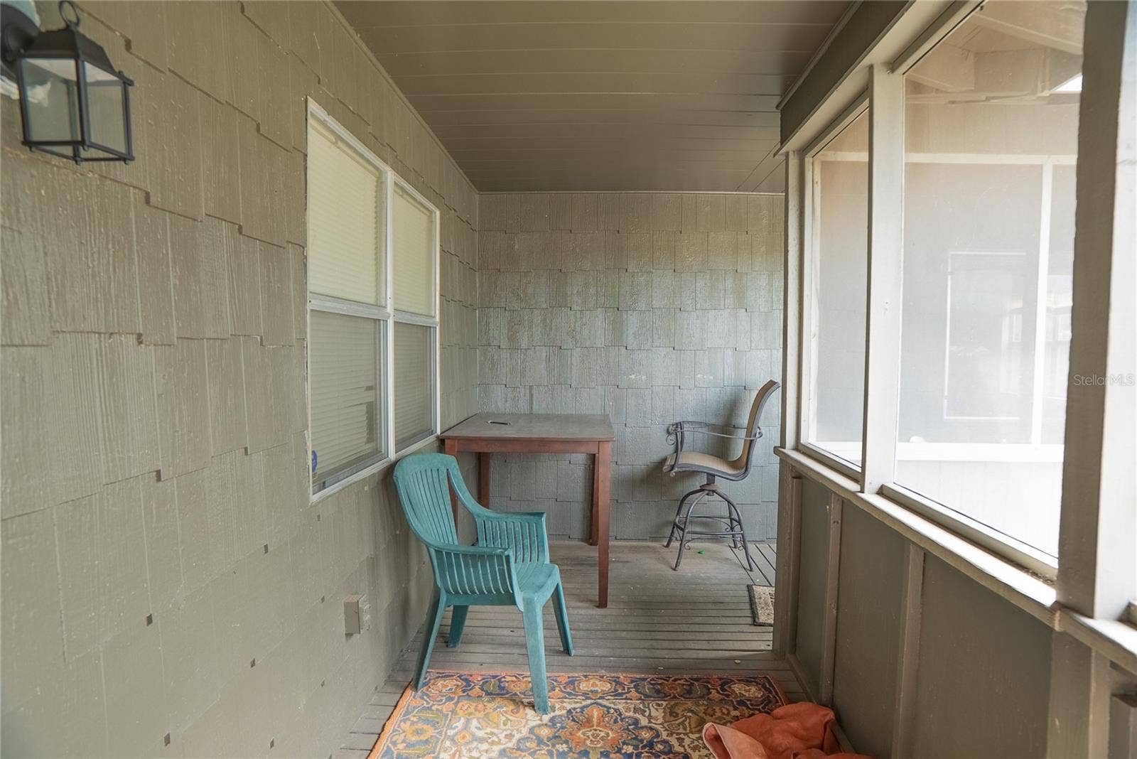 Wrap around front porch, screened in