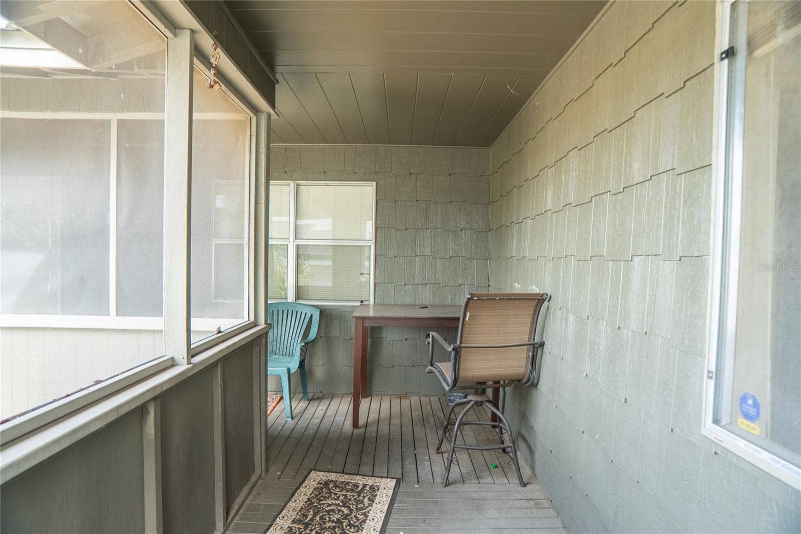 Wrap around front porch, screened in