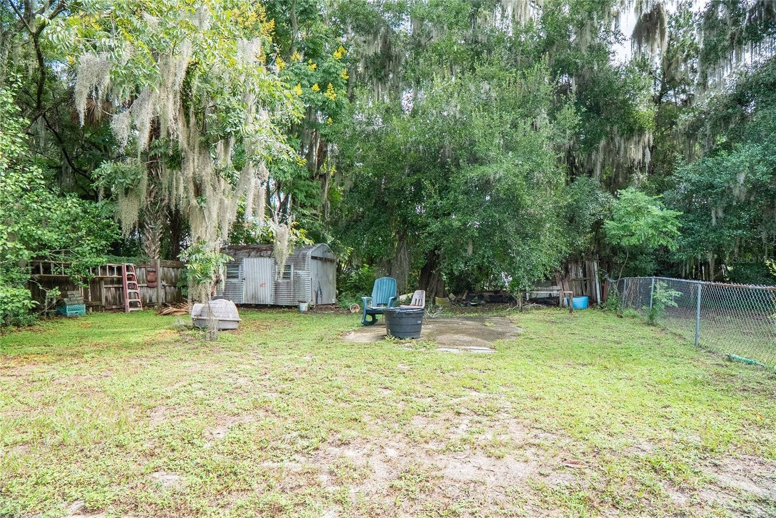Backyard with ample outdoor space at 311 S Thompson Avenue, DeLand, FL 32720, situated on a 0.17-acre lot.