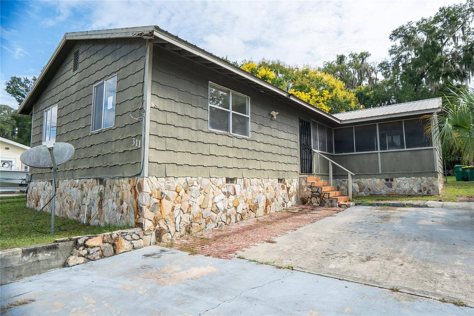 311 S Thompson Avenue, DeLand, FL 32720  Three-bedroom, two-bathroom home offered at $150,000 in Volusia County. Short sale with renovation potential.