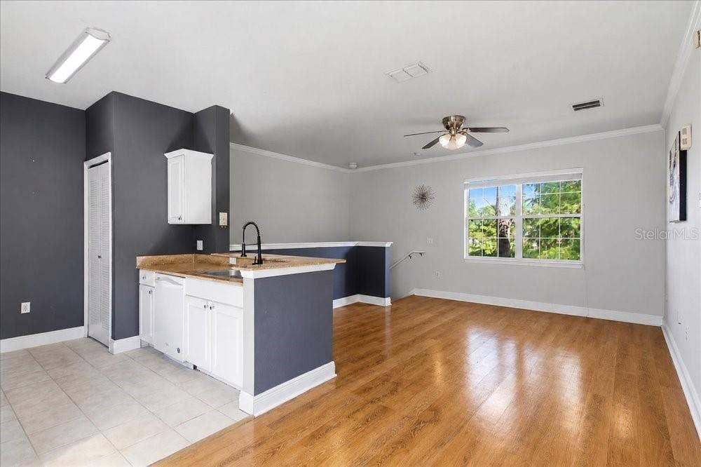 341 SOUTHERN PECAN CIRCLE, #202, Winter Garden, FL 34787 Wide view of the living area and kitchen