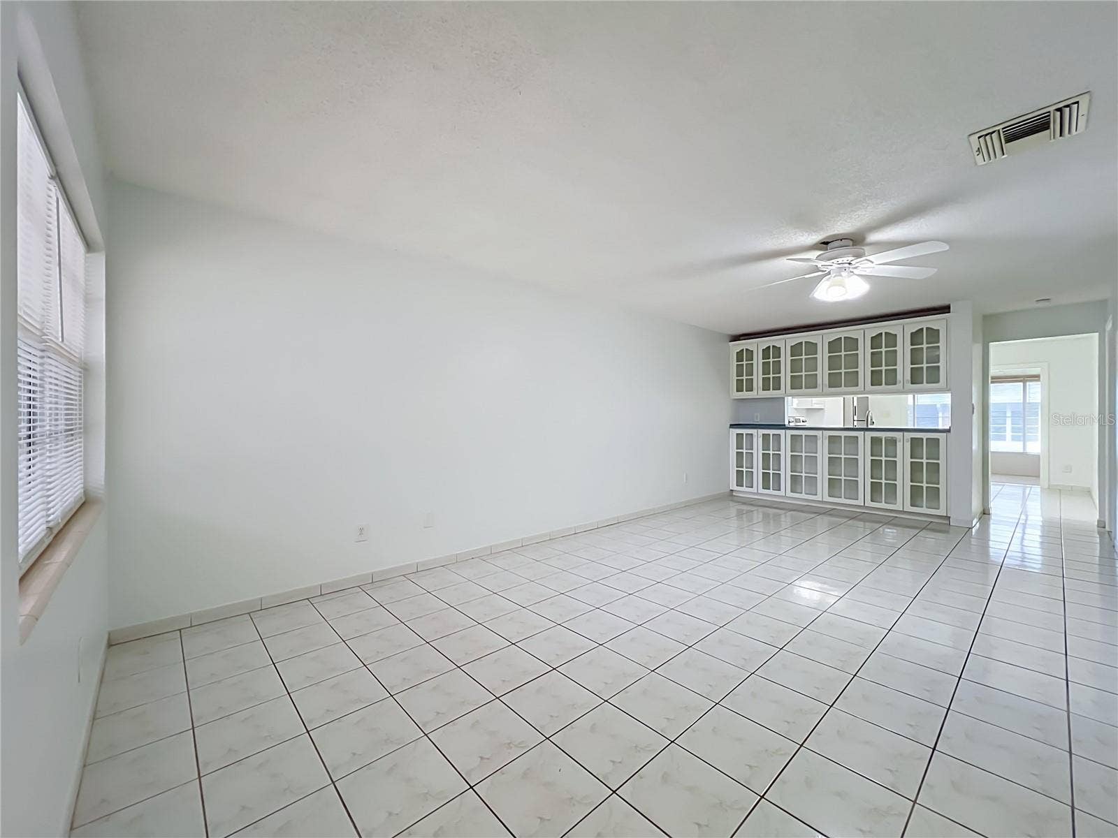 1225 CARRIAGE LANE, #1, Orlando, FL 32807 Bright and spacious living area with easy-to-maintain ceramic tile flooring.