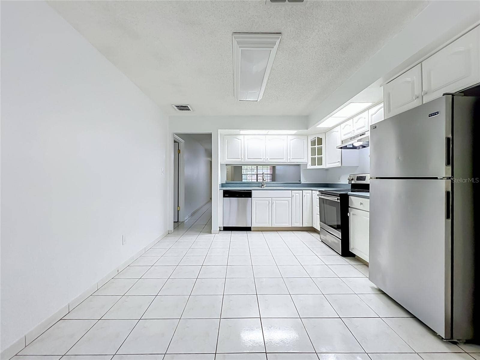 1225 CARRIAGE LANE, #1, Orlando, FL 32807 Kitchen offers additional space for a breakfast or dining area.