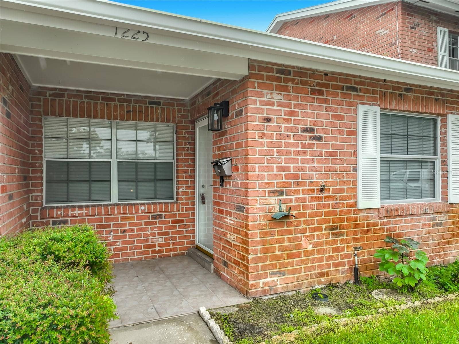 1225 CARRIAGE LANE, #1, Orlando, FL 32807 Brick exterior adds classic character to this well-maintained community.