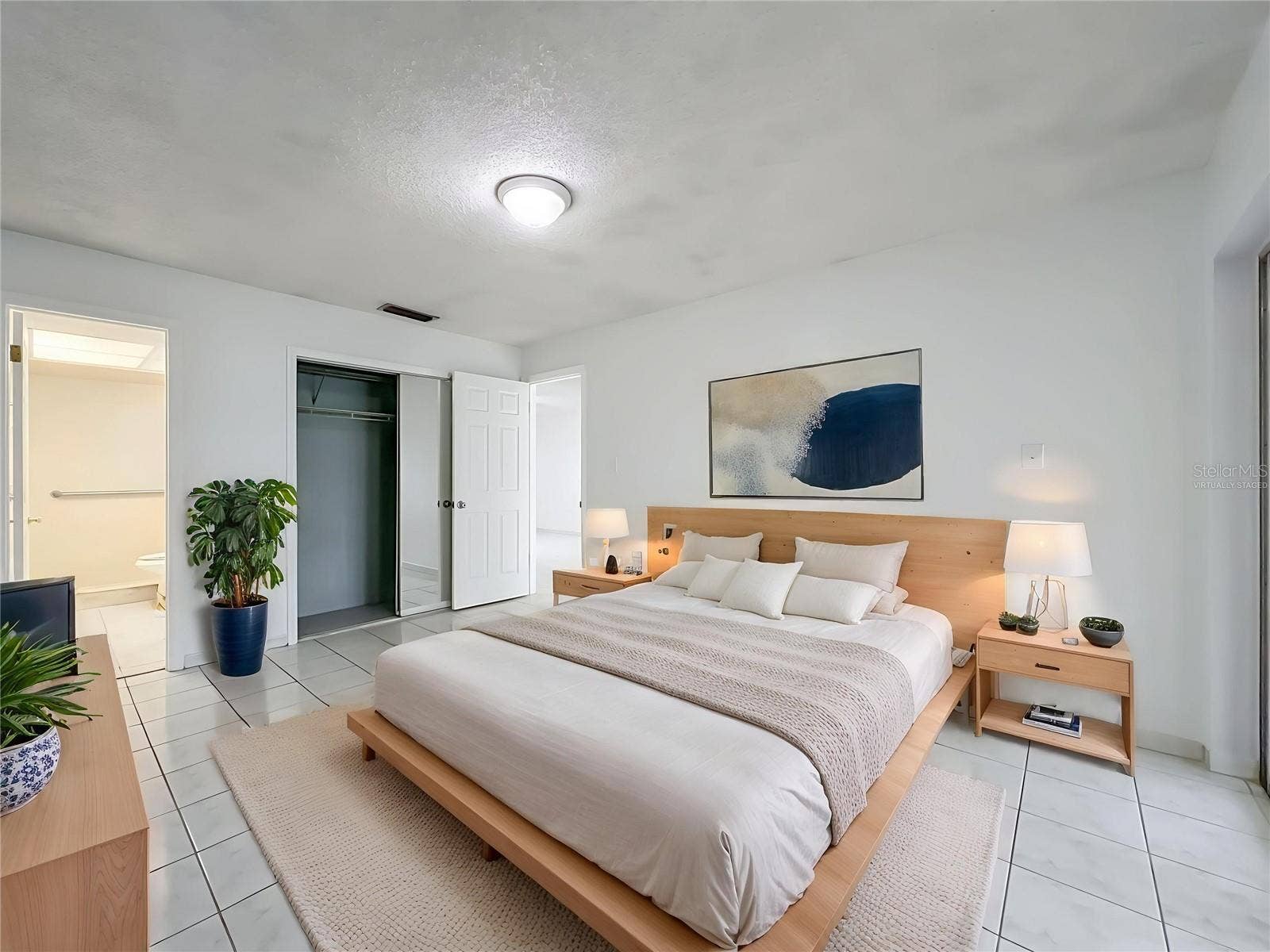 1225 CARRIAGE LANE, #1, Orlando, FL 32807 Virtually staged primary bedroom showcasing the generous room size and possibilities.
