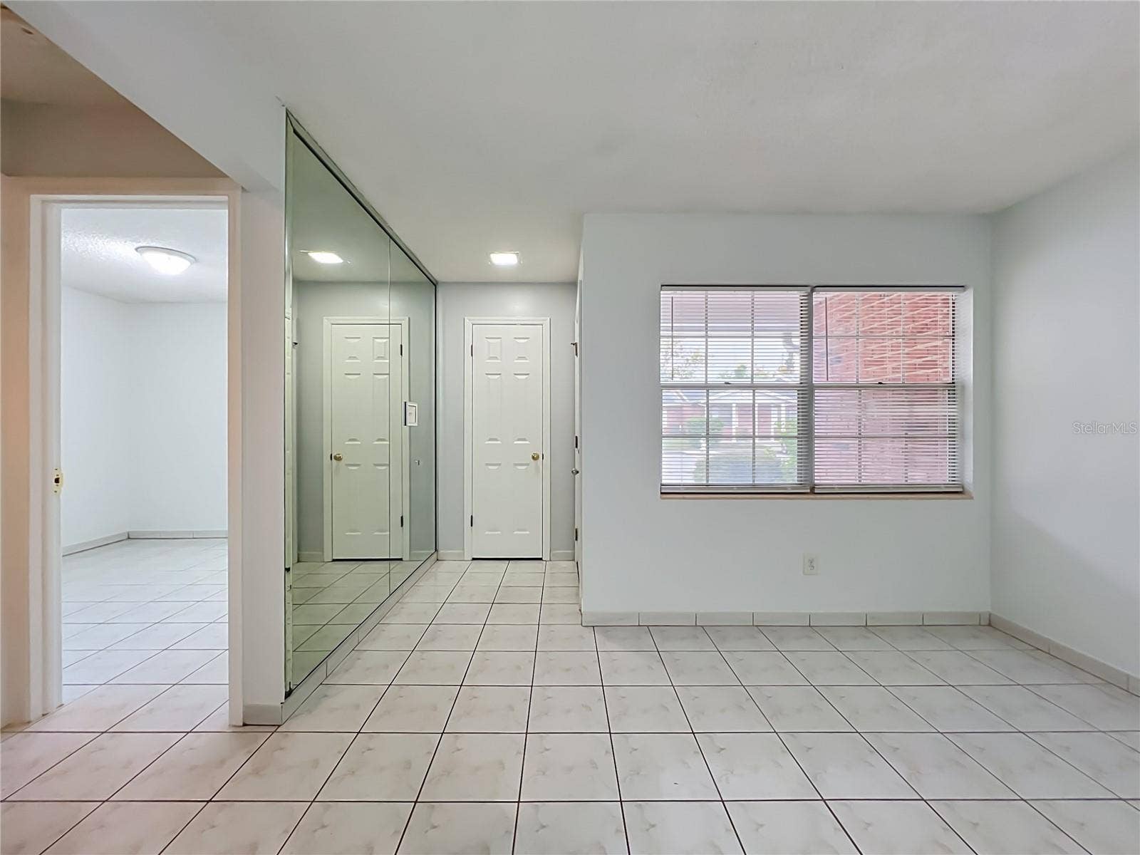 1225 CARRIAGE LANE, #1, Orlando, FL 32807 Open layout with plenty of natural light and a comfortable flow throughout the home.