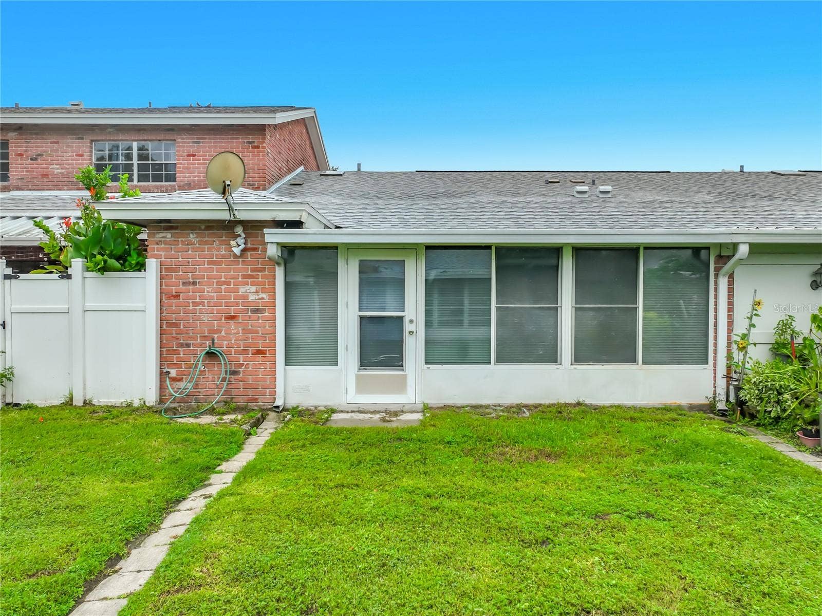 1225 CARRIAGE LANE, #1, Orlando, FL 32807 Rear exterior view of this charming one-story home.