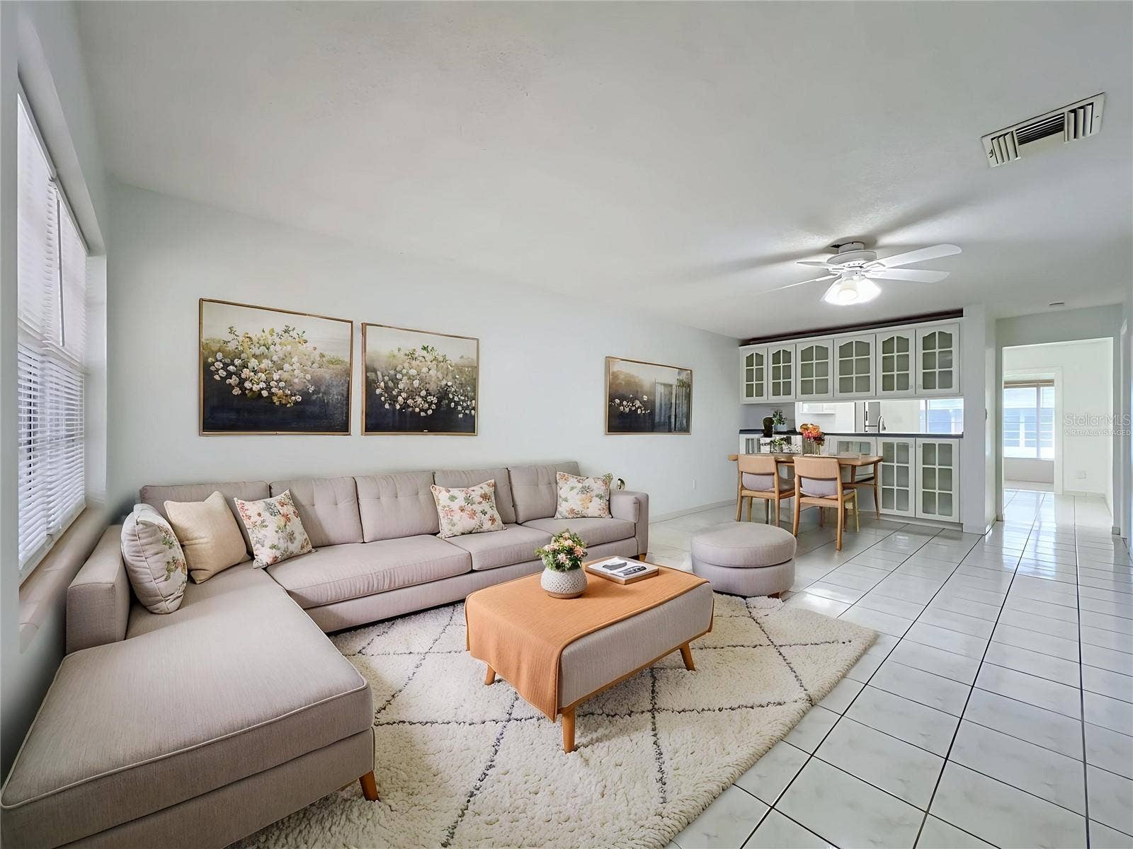 1225 CARRIAGE LANE, #1, Orlando, FL 32807 Virtually staged to showcase the possibilities of the spacious living and dining area.